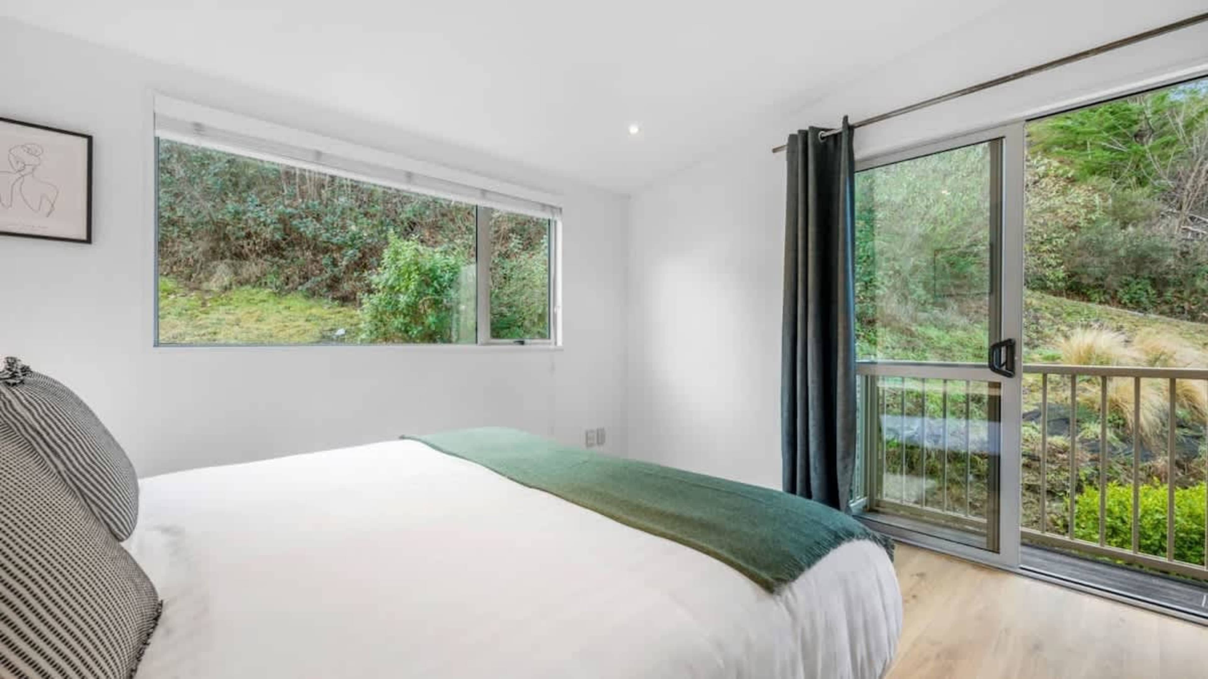 Cozy Fourth Bedroom
Relax in the comfortable fourth bedroom, featuring a peaceful atmosphere and ample space for a restful night’s sleep, perfect for guests seeking tranquility.