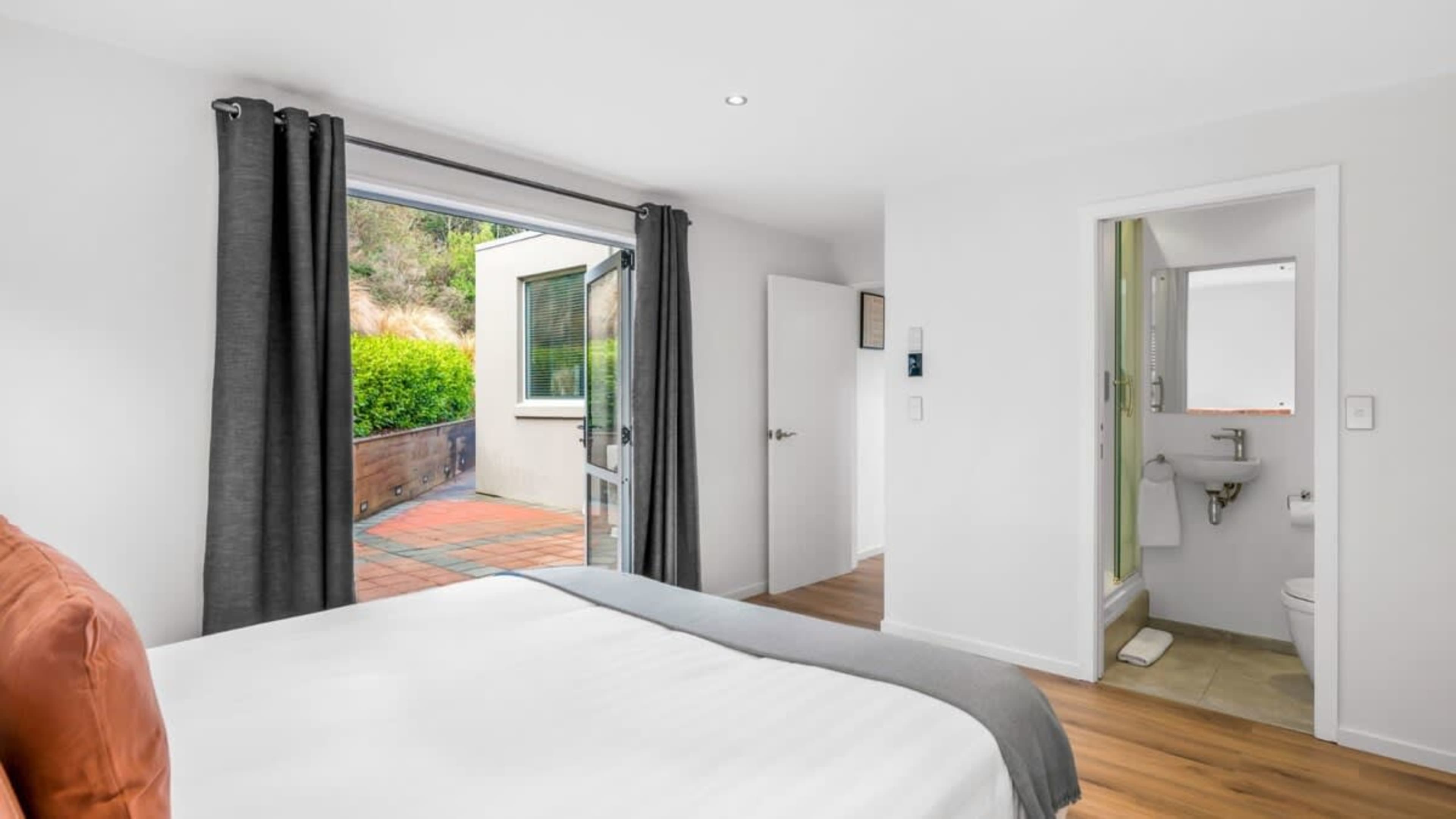 Comfortable Bedroom with Ensuite and Patio Access
Enjoy the convenience of an ensuite in the third bedroom, with easy access to a peaceful outdoor patio, ideal for relaxing in the fresh air after a day of exploration.
