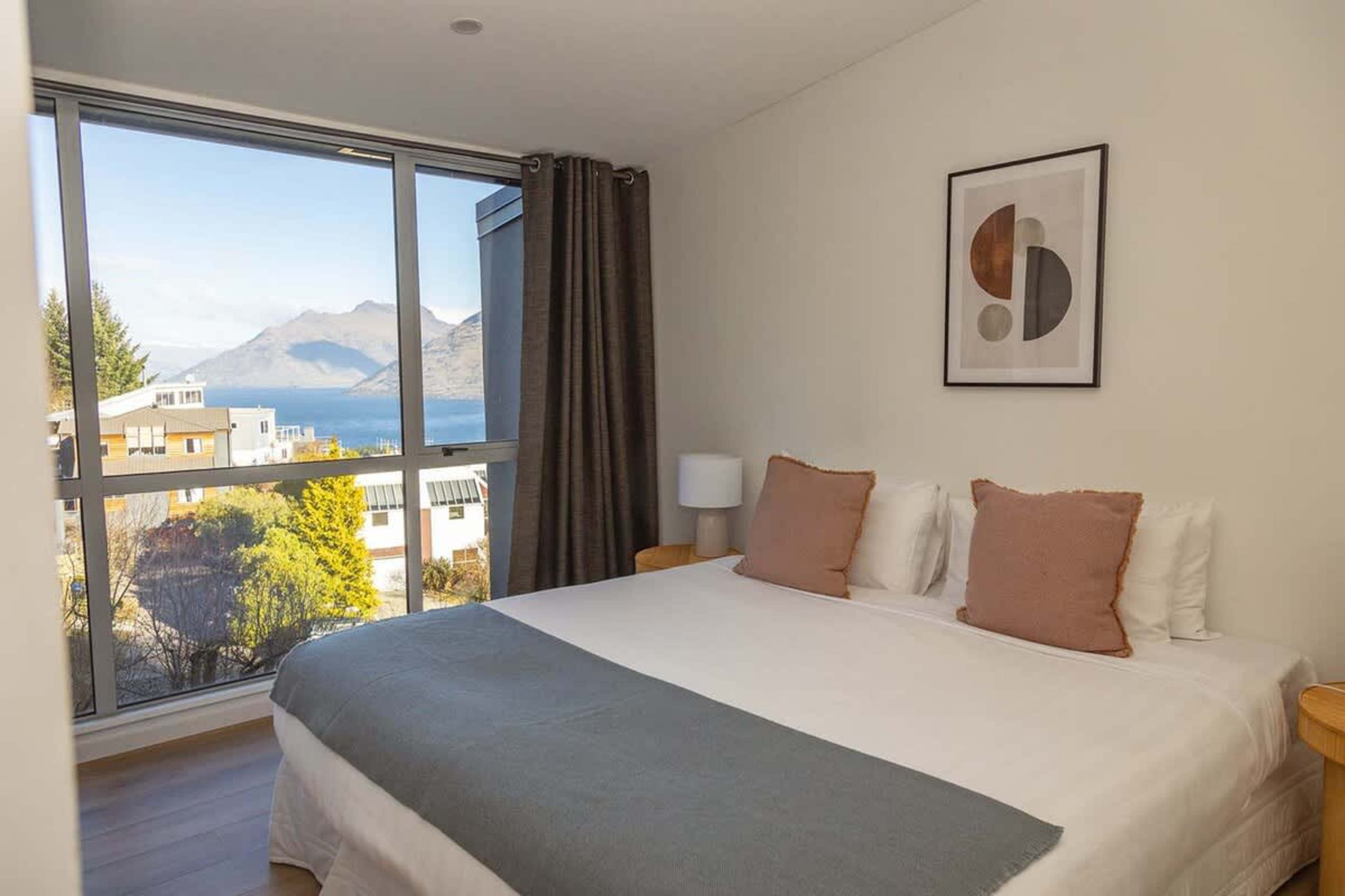Master Bedroom with Uninterrupted Views
Enjoy the luxury of a master bedroom that boasts sweeping lake and mountain vistas, designed to provide the perfect setting for a restful night’s sleep and relaxing mornings.