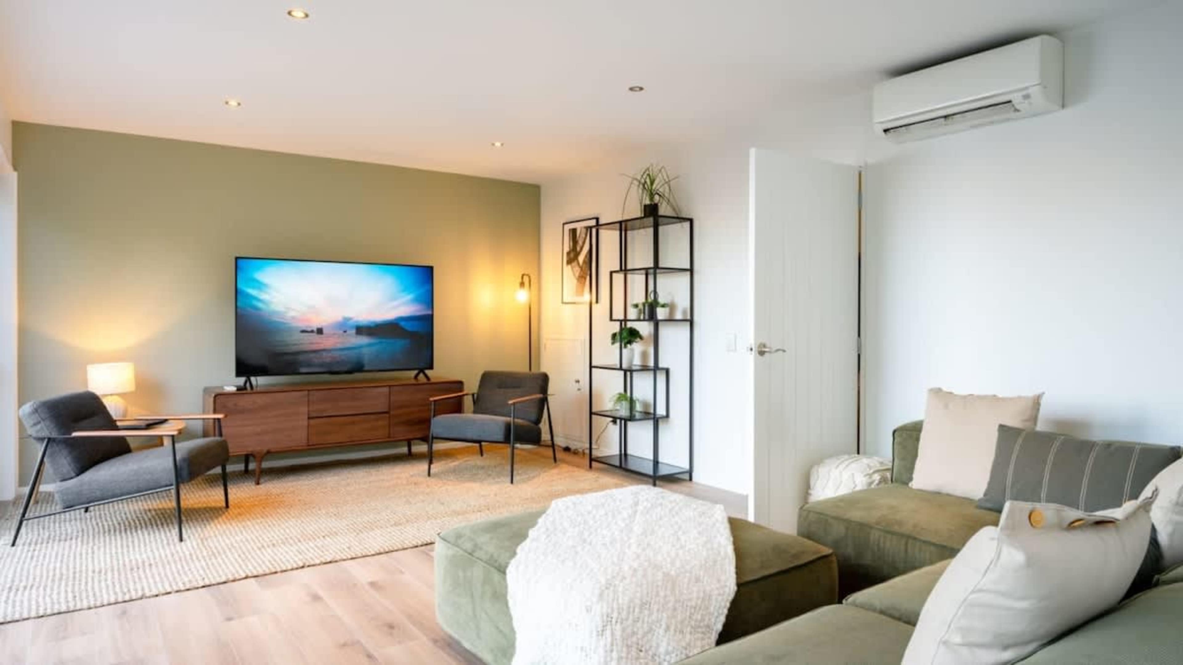 Inviting Living Space
Enjoy the comforts of the living room with stunning lake and mountain vistas, a cozy setting perfect for relaxing after a short drive to Queenstown.
