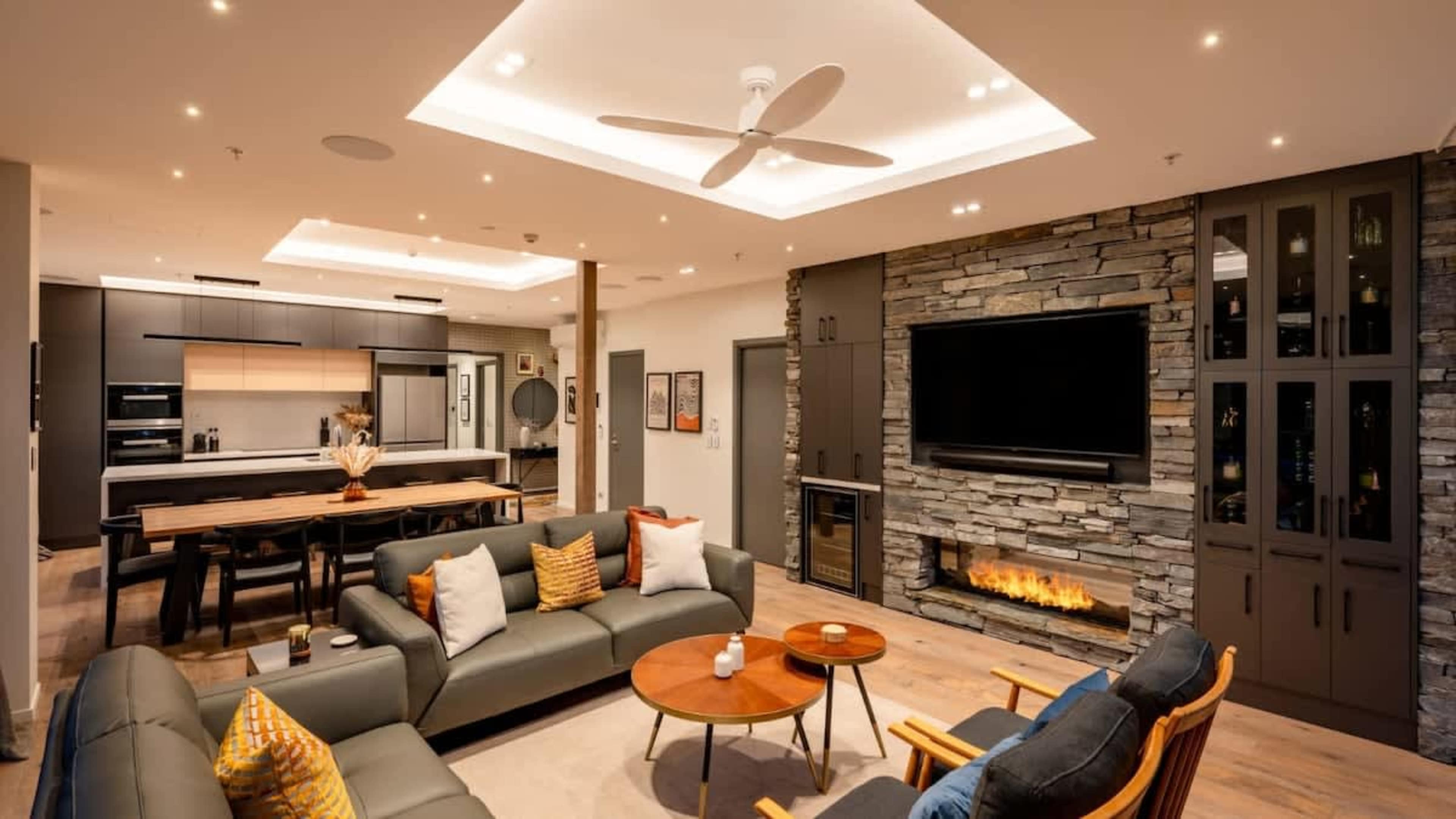 Luxe Living Room with Fire and Views
Enjoy the comfort of the penthouse living room, where a gas fireplace, air conditioning, and spectacular views create an inviting space for relaxation and entertainment.