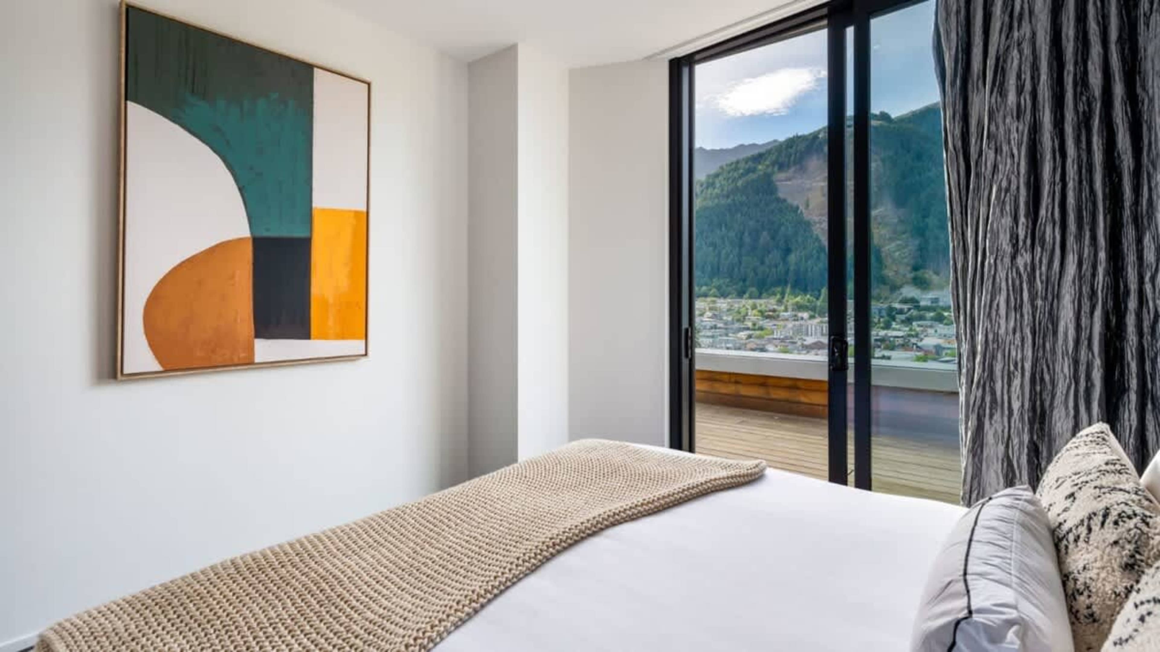 Tranquil Second Bedroom with Outdoor Flow
Step out onto the deck from the second bedroom, where stunning surroundings and outdoor serenity enhance your stay.