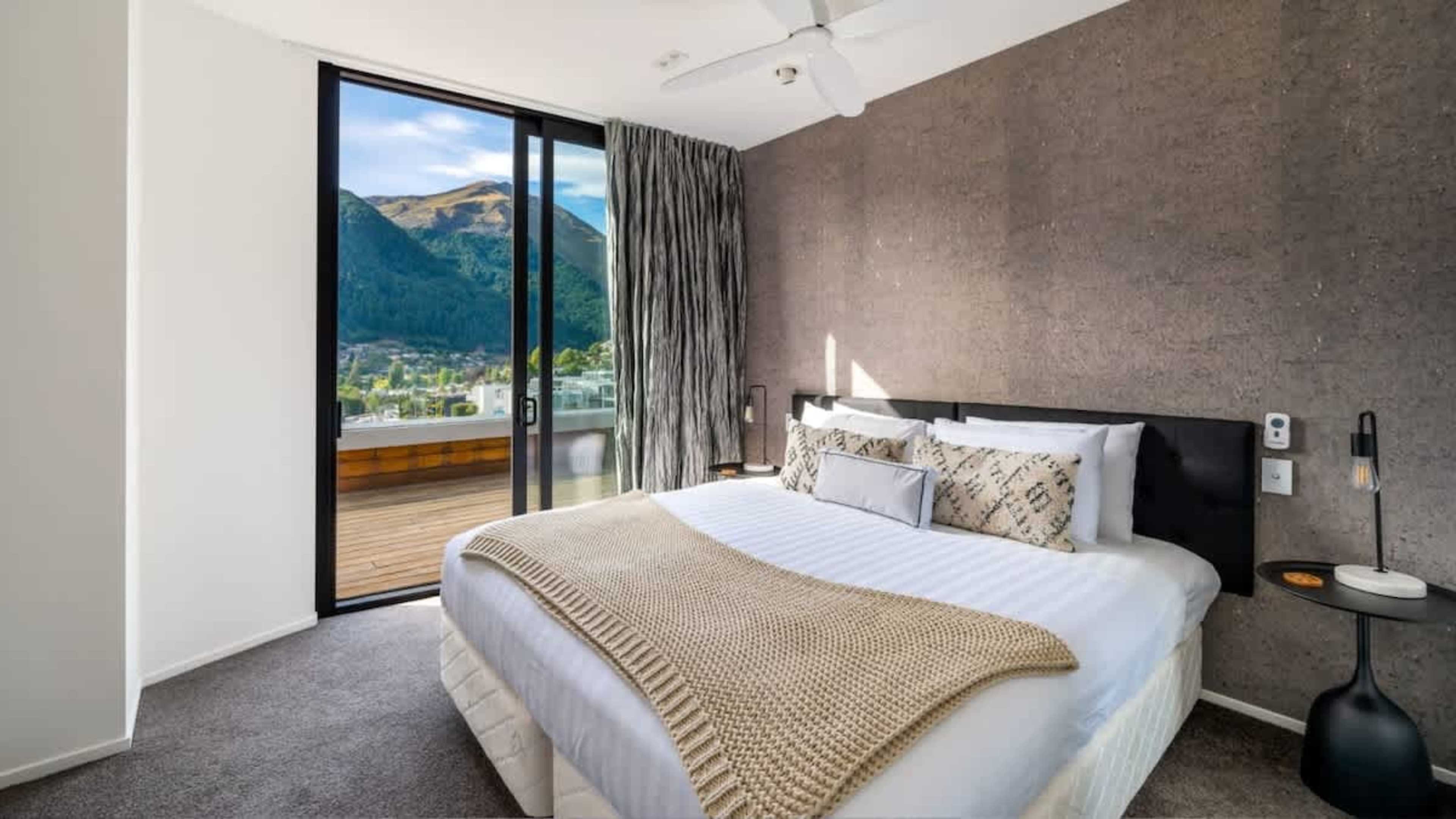 Second Bedroom with Private Deck Access
Enjoy the comfort of the second bedroom, offering direct access to the deck for a peaceful space to relax and take in the fresh mountain air.