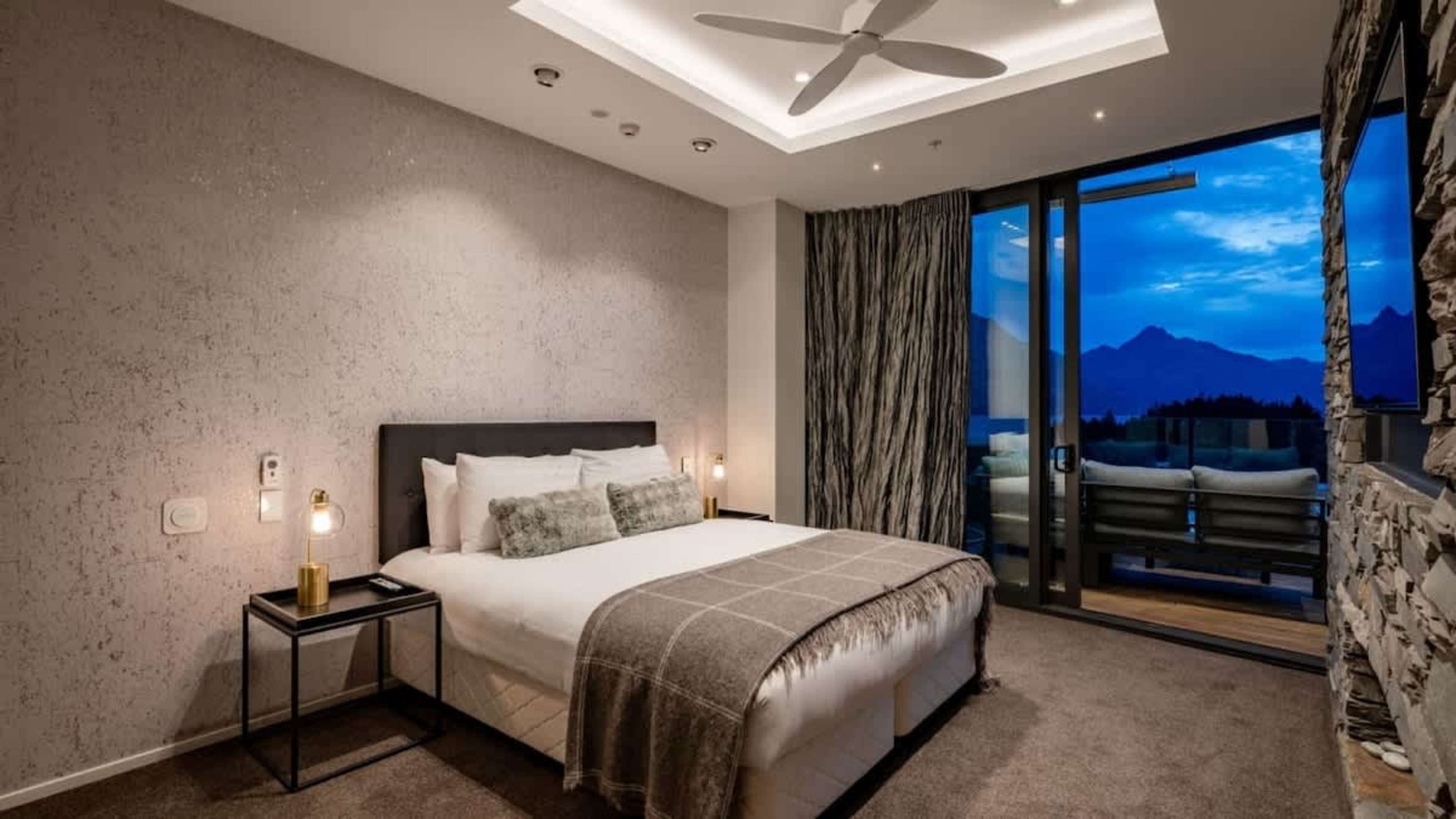 Luxurious Master Bedroom with Ensuite, Views & AC
Retreat to the master bedroom, featuring a private ensuite, a spacious wardrobe, and direct deck access with breathtaking views of Queenstown’s mountains and lake.