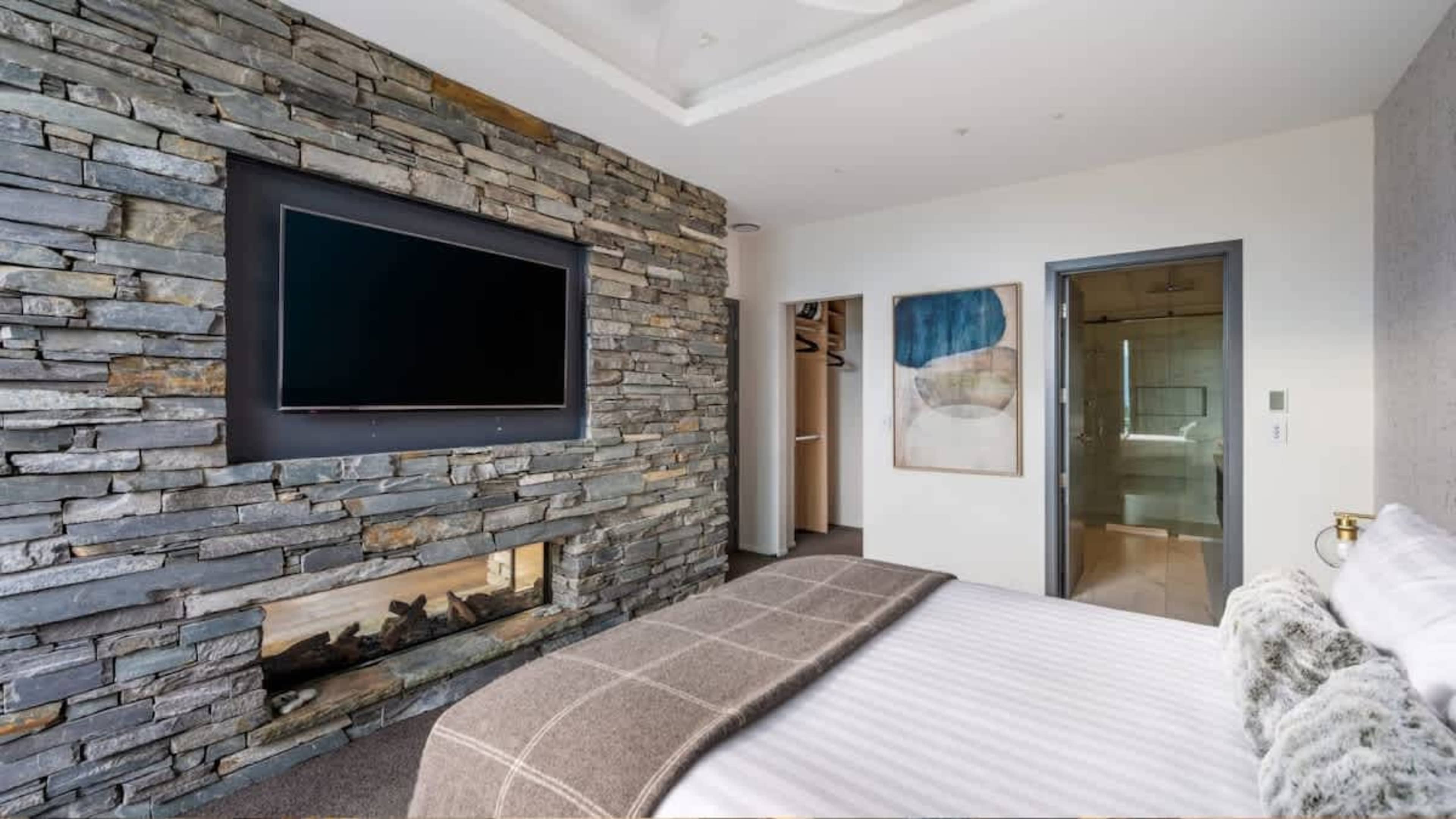 Elegant Master Bedroom with Scenic Deck Views
Unwind in the master bedroom, where an ensuite, walk-in wardrobe, and deck access combine with incredible views to create the ultimate private retreat.