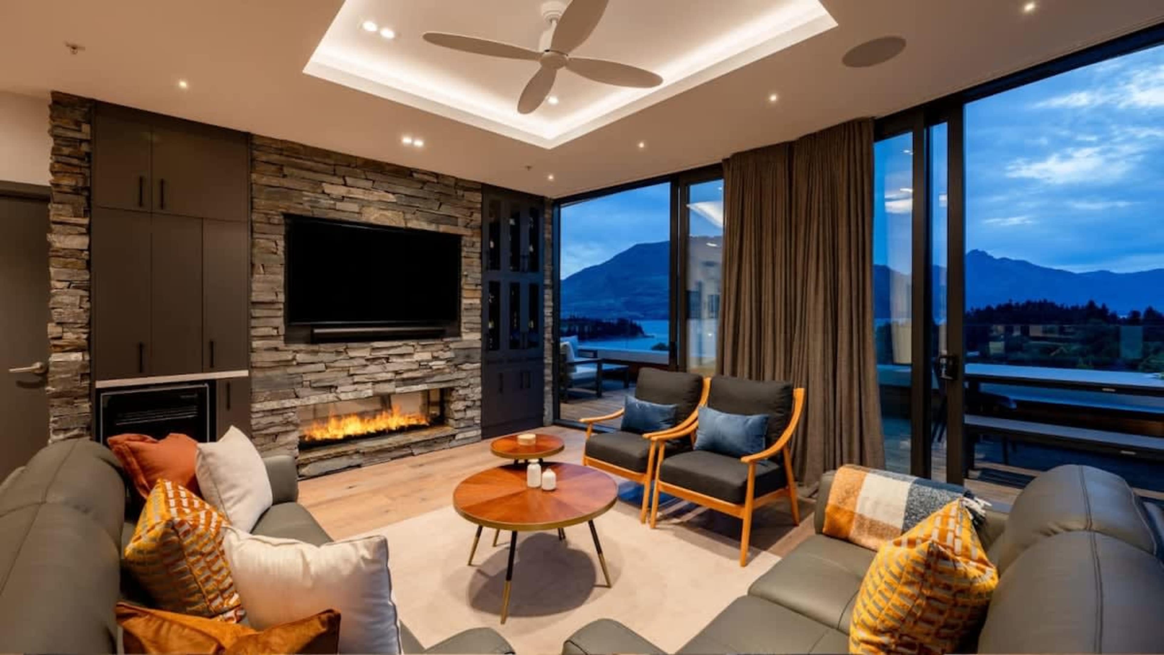 Spacious Living Room with Stunning Views
Relax in the expansive living room, featuring a cozy gas fireplace, air conditioning, and floor-to-ceiling windows that frame breathtaking Queenstown views.