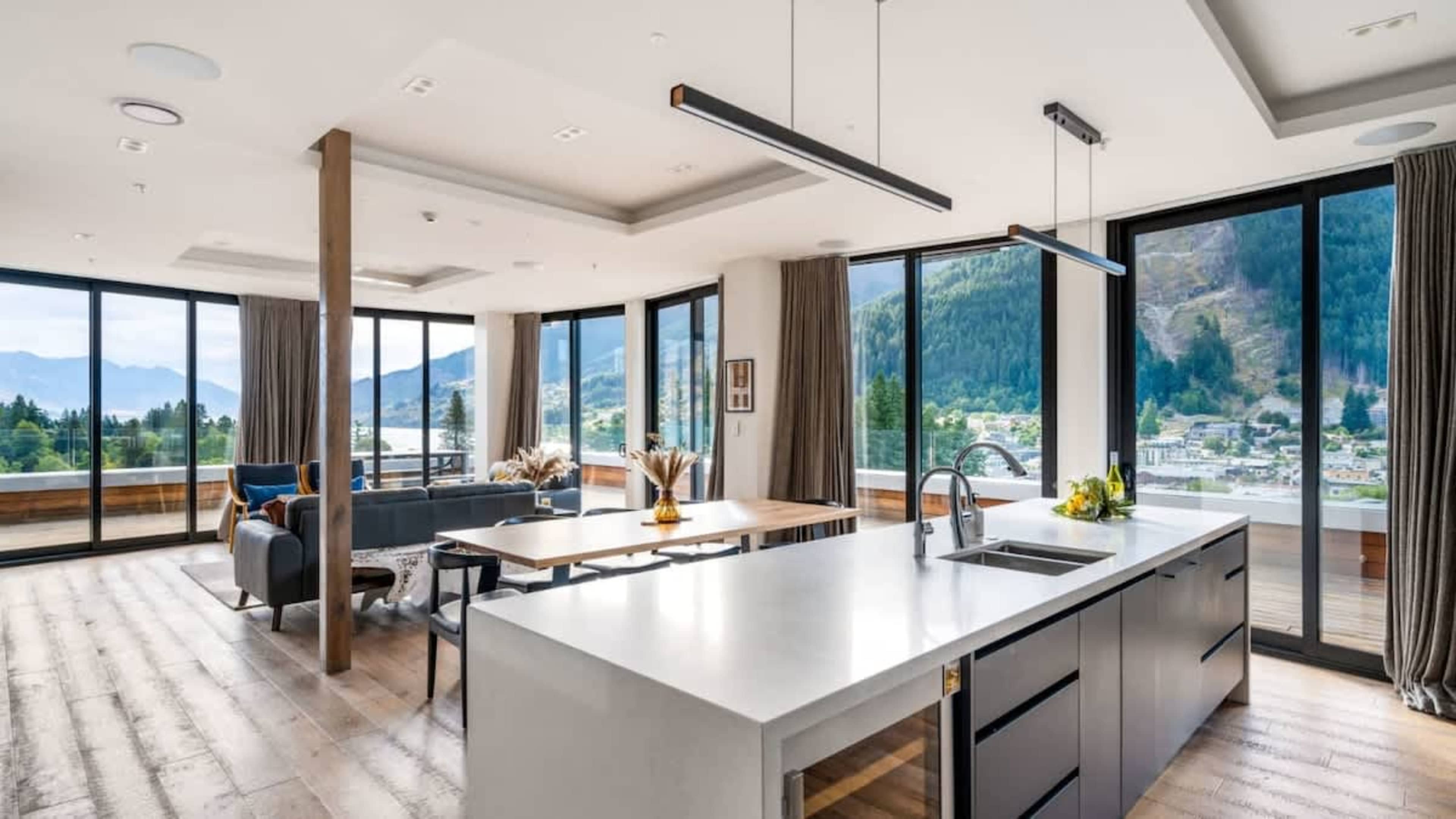 Modern Kitchen with Indoor-Outdoor Flow
Enjoy the contemporary kitchen, complete with premium finishes, all the essentials for gourmet cooking, and seamless access to the dining area and decks.