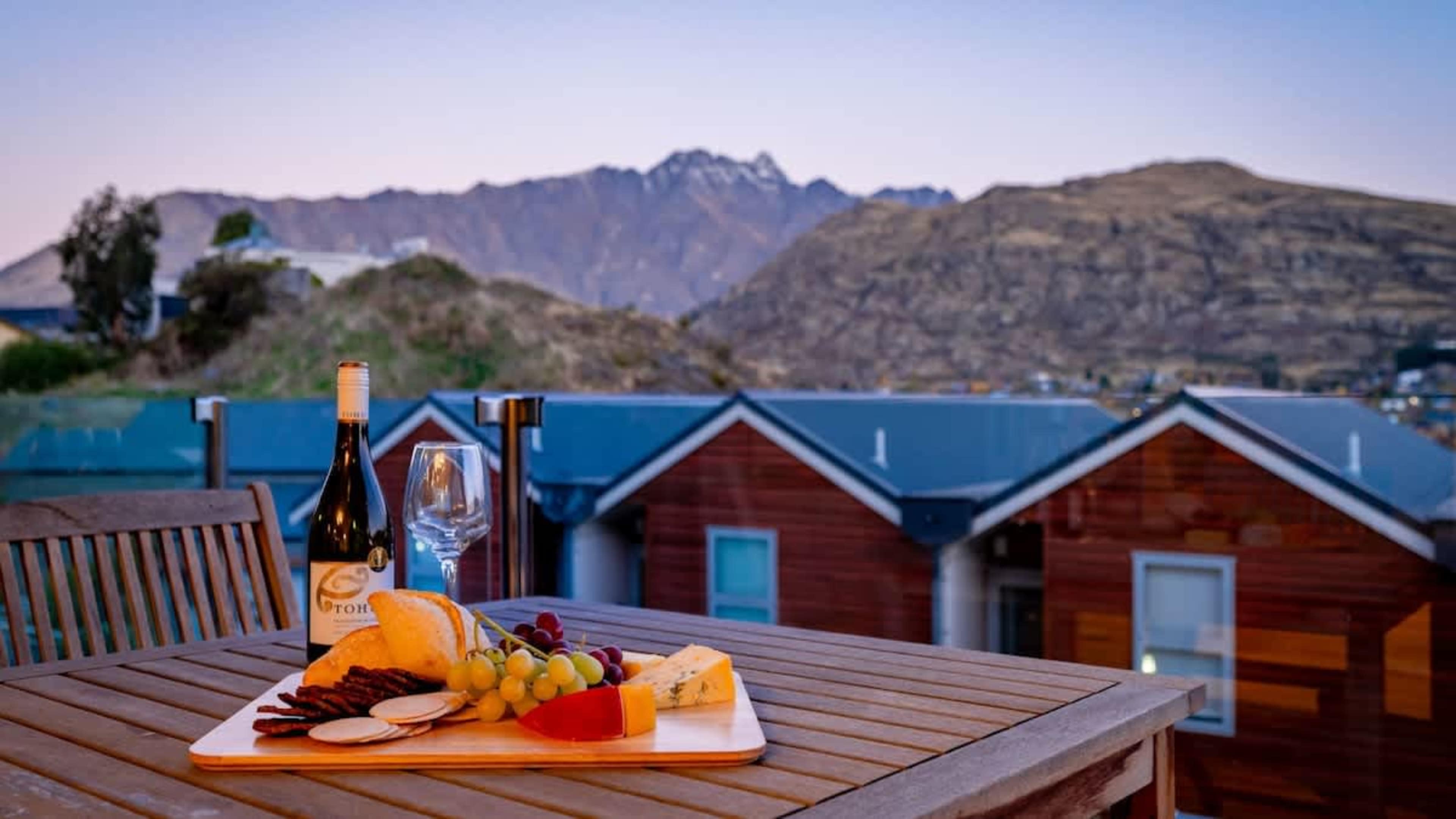 Relax on the private balcony with a comfortable seating area, offering breathtaking views of Lake Wakatipu and the surrounding mountains—perfect for sunrise or sunset.