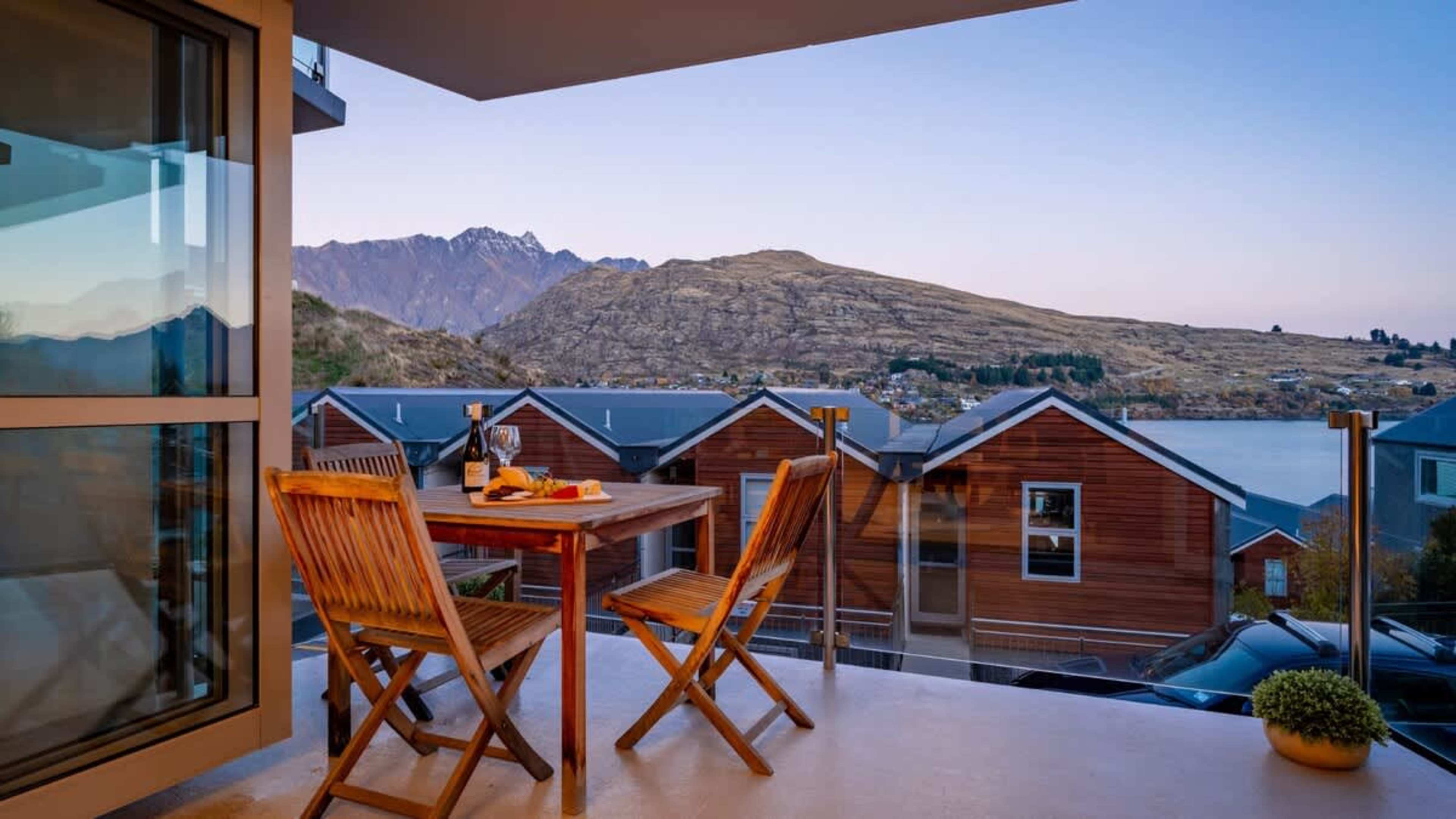 Enjoy the stunning lake and mountain vistas from the spacious balcony, complete with a cozy seating area for al fresco dining or evening drinks.