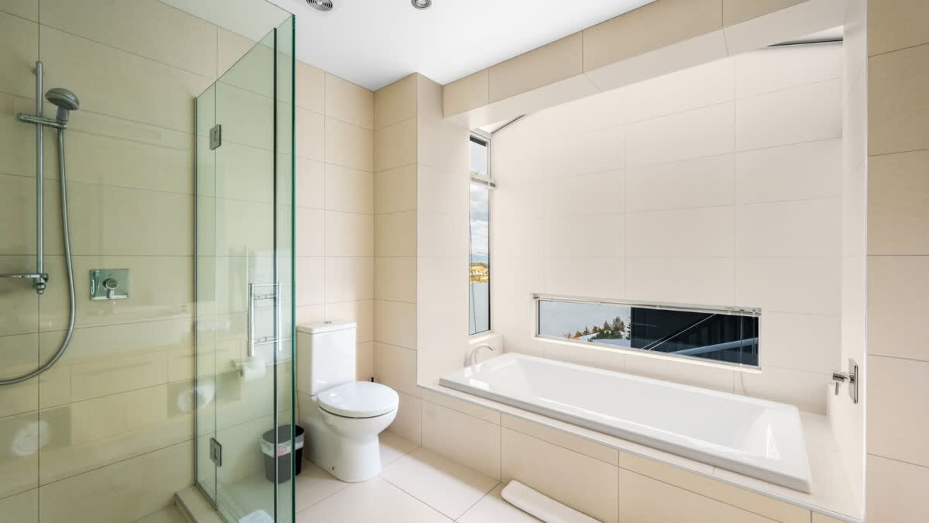 Shared Bathroom with Heated Floors, Bath, and Ashley & Co Amenities
Relax in the shared bathroom, featuring heated floors, a soothing bath, a walk-in shower, and premium Ashley & Co toiletries for a luxurious experience.