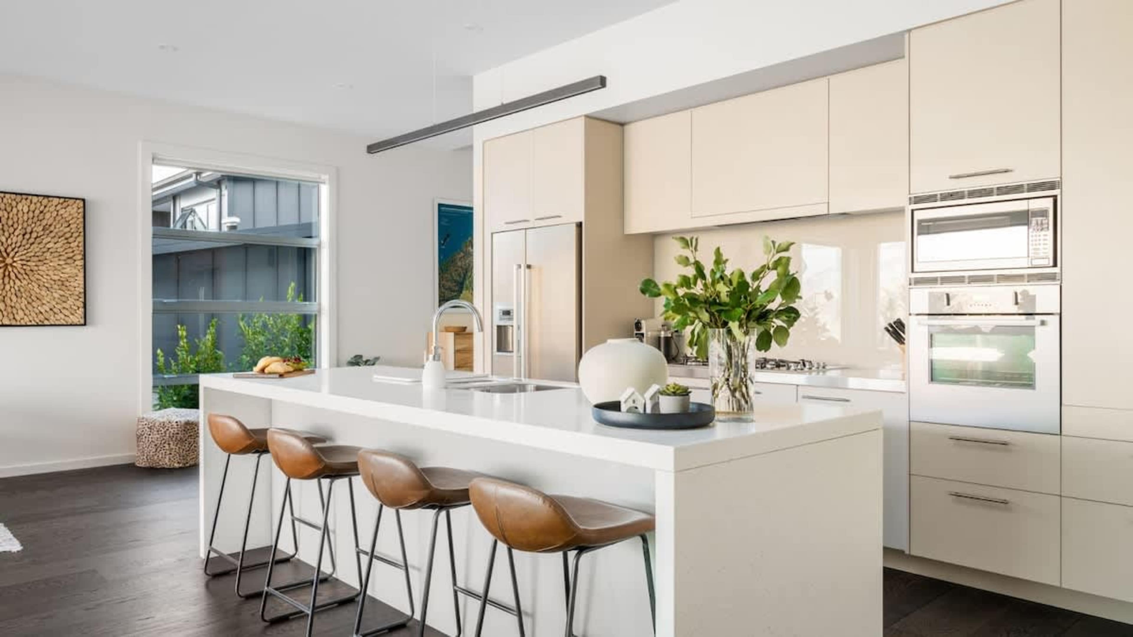 Modern Kitchen with High-End Finishes
Enjoy cooking in the beautifully designed kitchen, equipped with premium appliances, a Nespresso machine, and large windows that frame breathtaking views of the surrounding landscape.