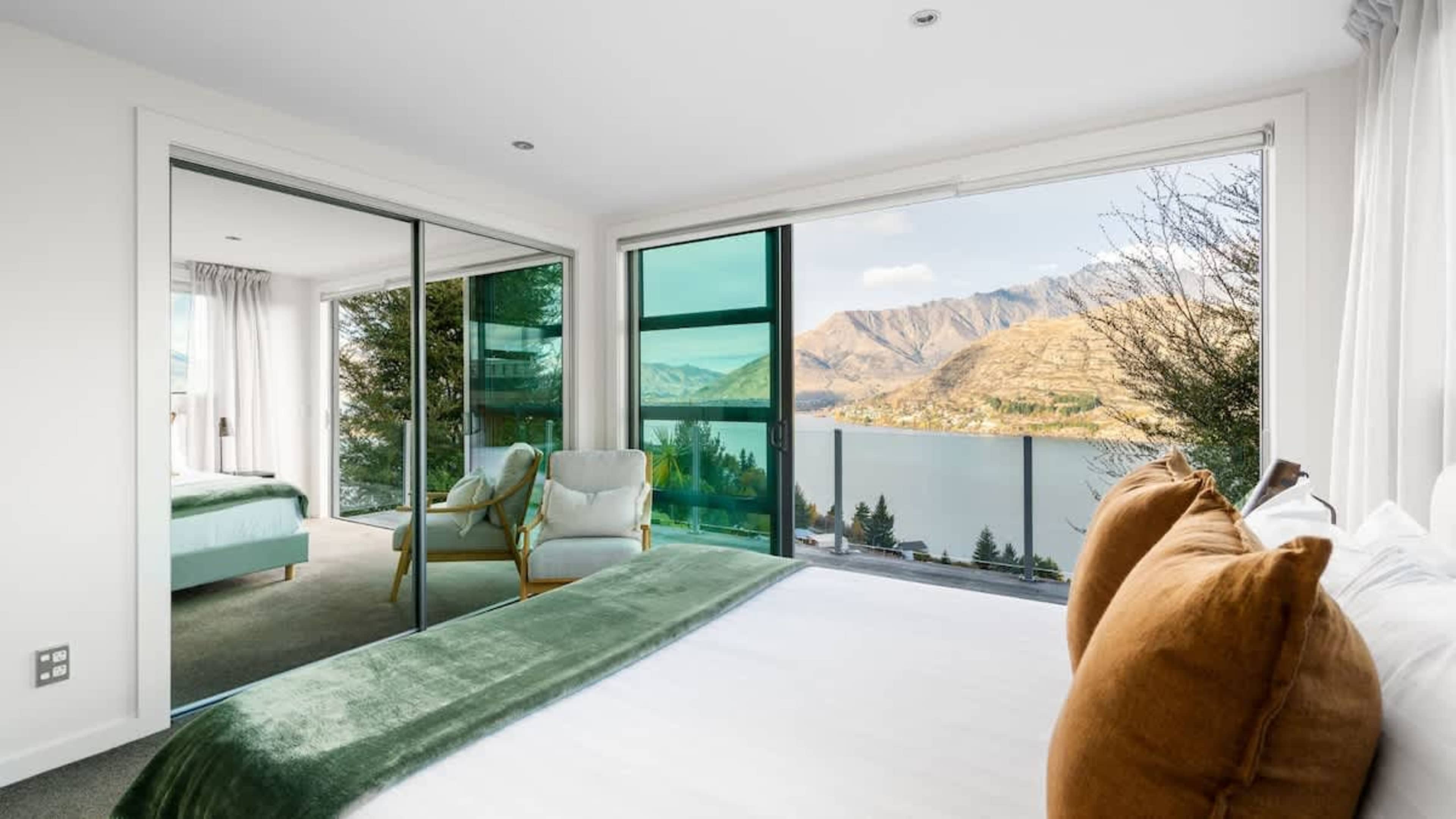 Third Bedroom with Scenic Views
Unwind in the third bedroom, featuring large windows that offer stunning views, creating a peaceful and picturesque retreat.