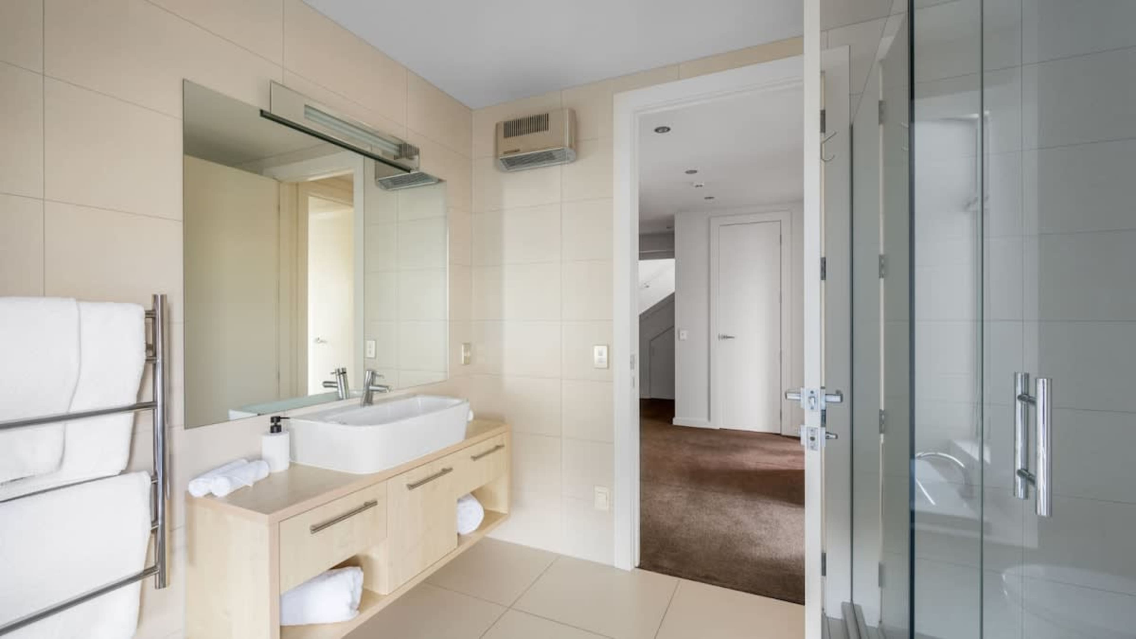 Luxurious Shared Bathroom with Bath, Shower, and Heated Floors
Enjoy the shared bathroom with heated floors, a spacious bath, a walk-in shower, and luxurious Ashley & Co toiletries, perfect for unwinding after a day of adventure.