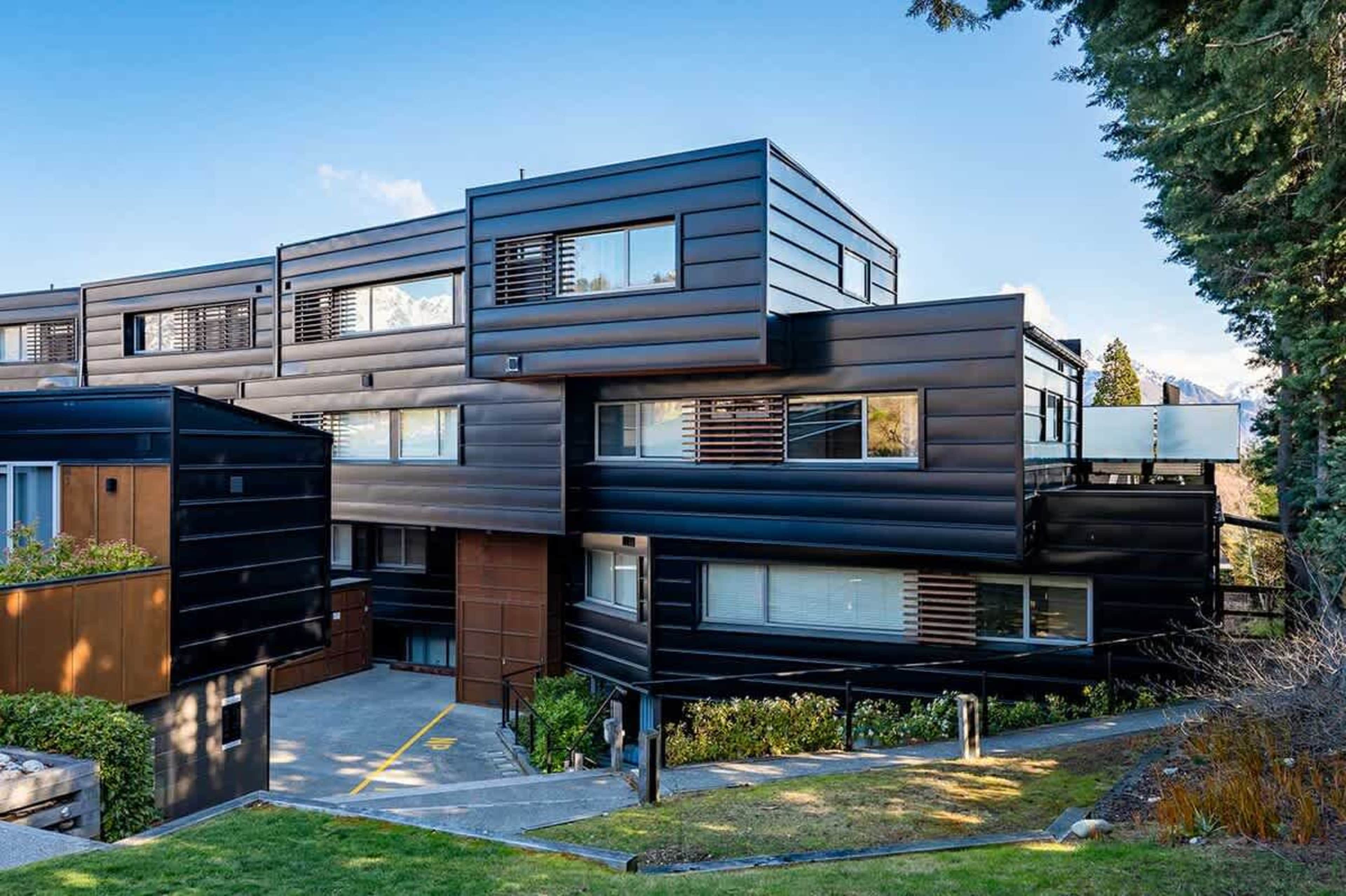 Experience the beauty of this contemporary building, featuring high-quality materials that reflect a commitment to luxury and durability. The expertly designed façade enhances the overall aesthetic, offering a warm welcome to your Queenstown getaway