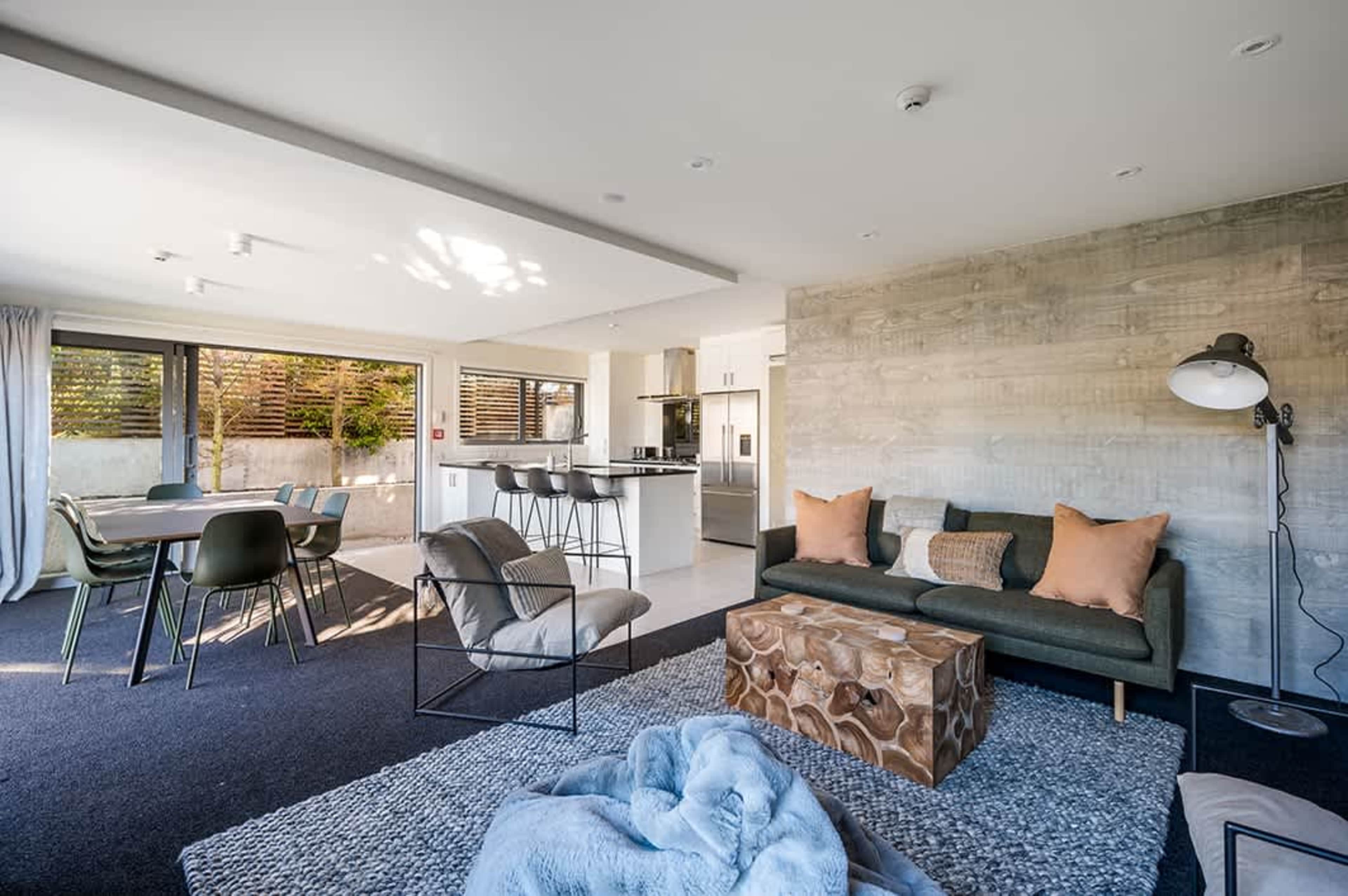 Comfort Meets Elegance
Unwind in this stylishly furnished living room, complete with plush seating, tasteful décor, and a cozy ambiance. Enjoy breathtaking views of the town and the serene mountains from the comfort of your couch.