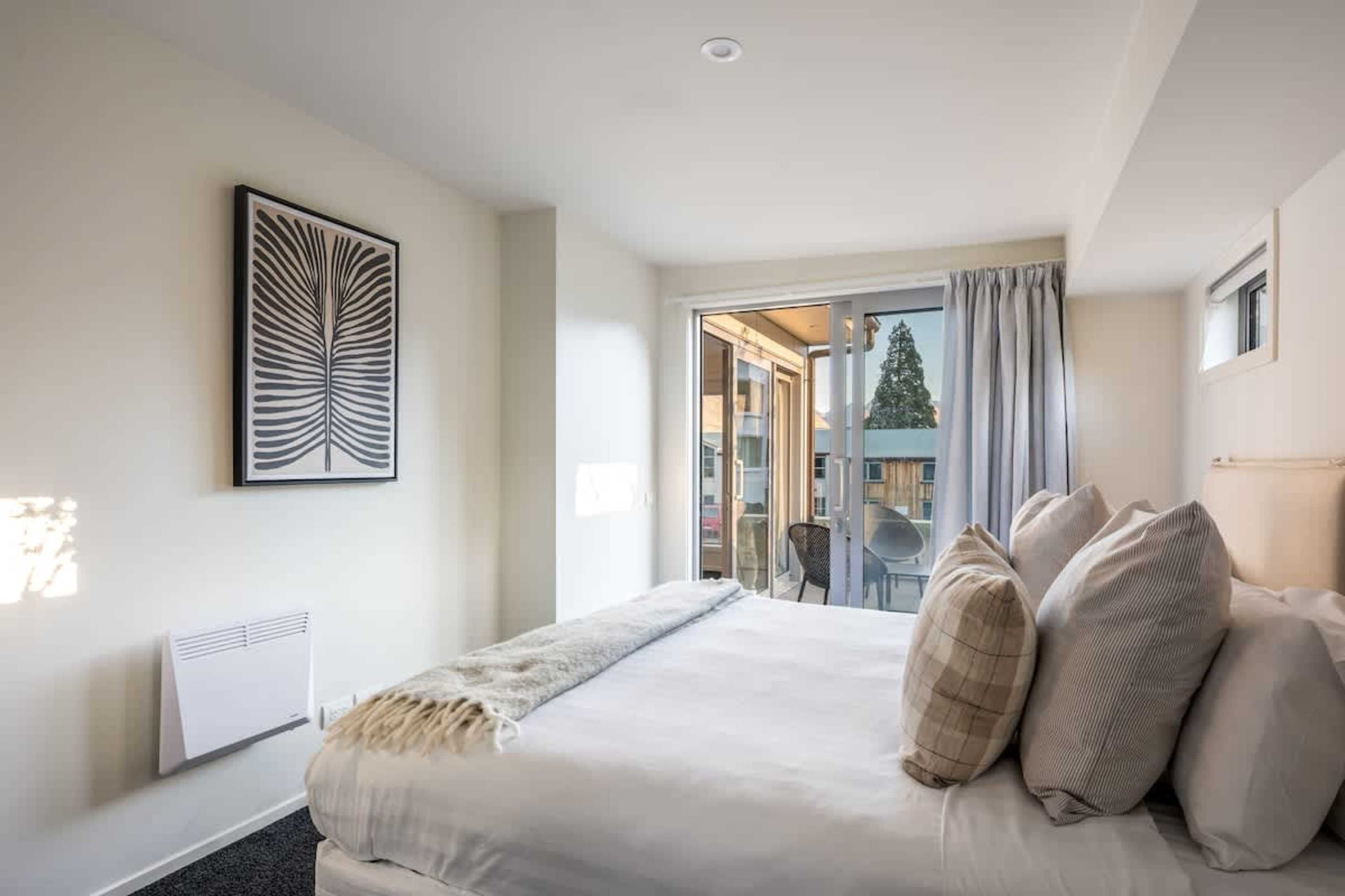 Bright and Comfortable Third Bedroom
The Third bedroom features a cozy bed, stylish décor, and plenty of natural light. A perfect space for relaxing, whether you’re here for a short stay or an extended getaway in Queenstown.