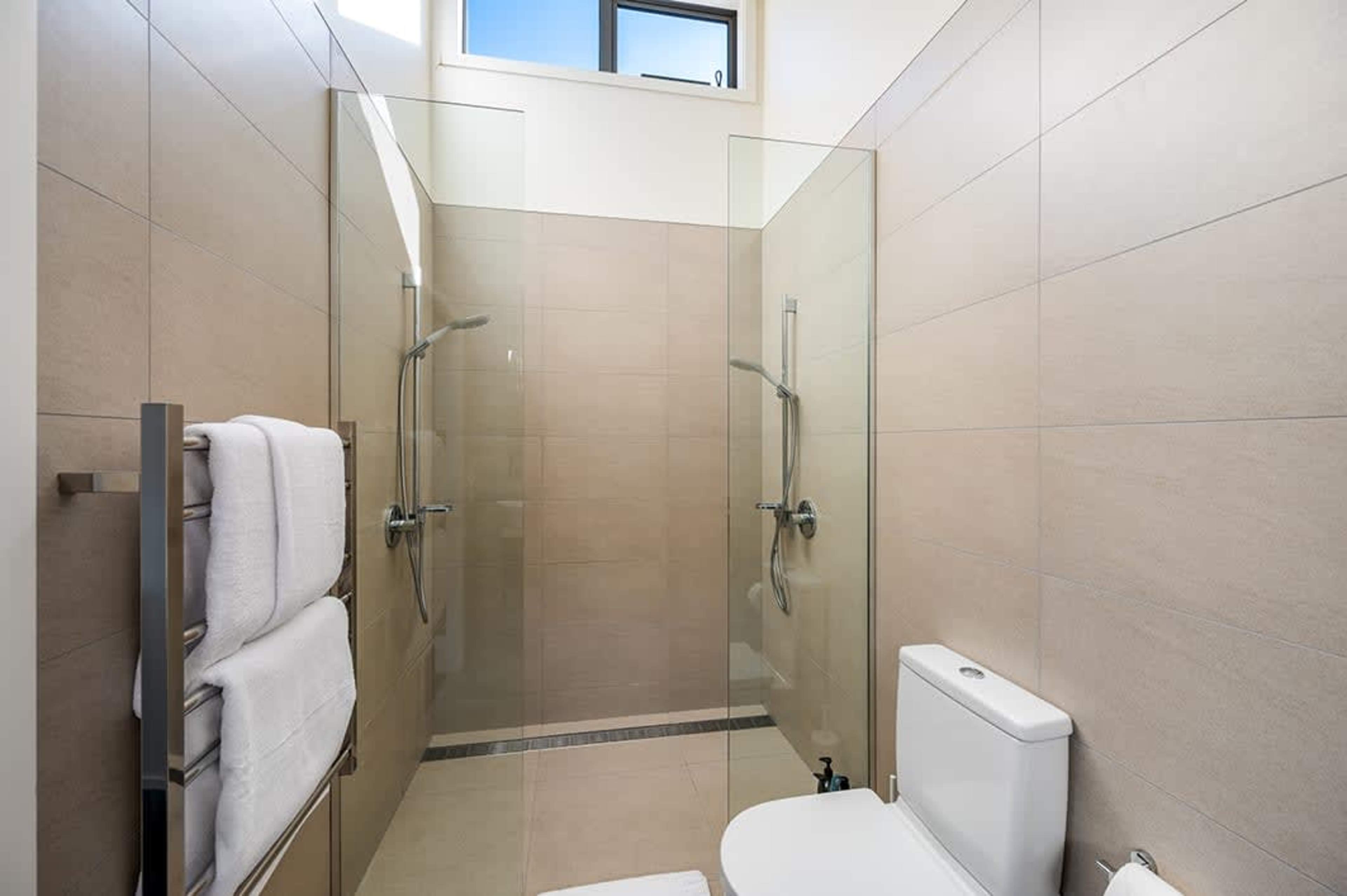 Modern Second Ensuite with Walk-In Shower
This sleek and modern ensuite features a walk-in shower, elegant fixtures, and all the mod cons for added comfort and convenience. A perfect private retreat for guests in the second bedroom.