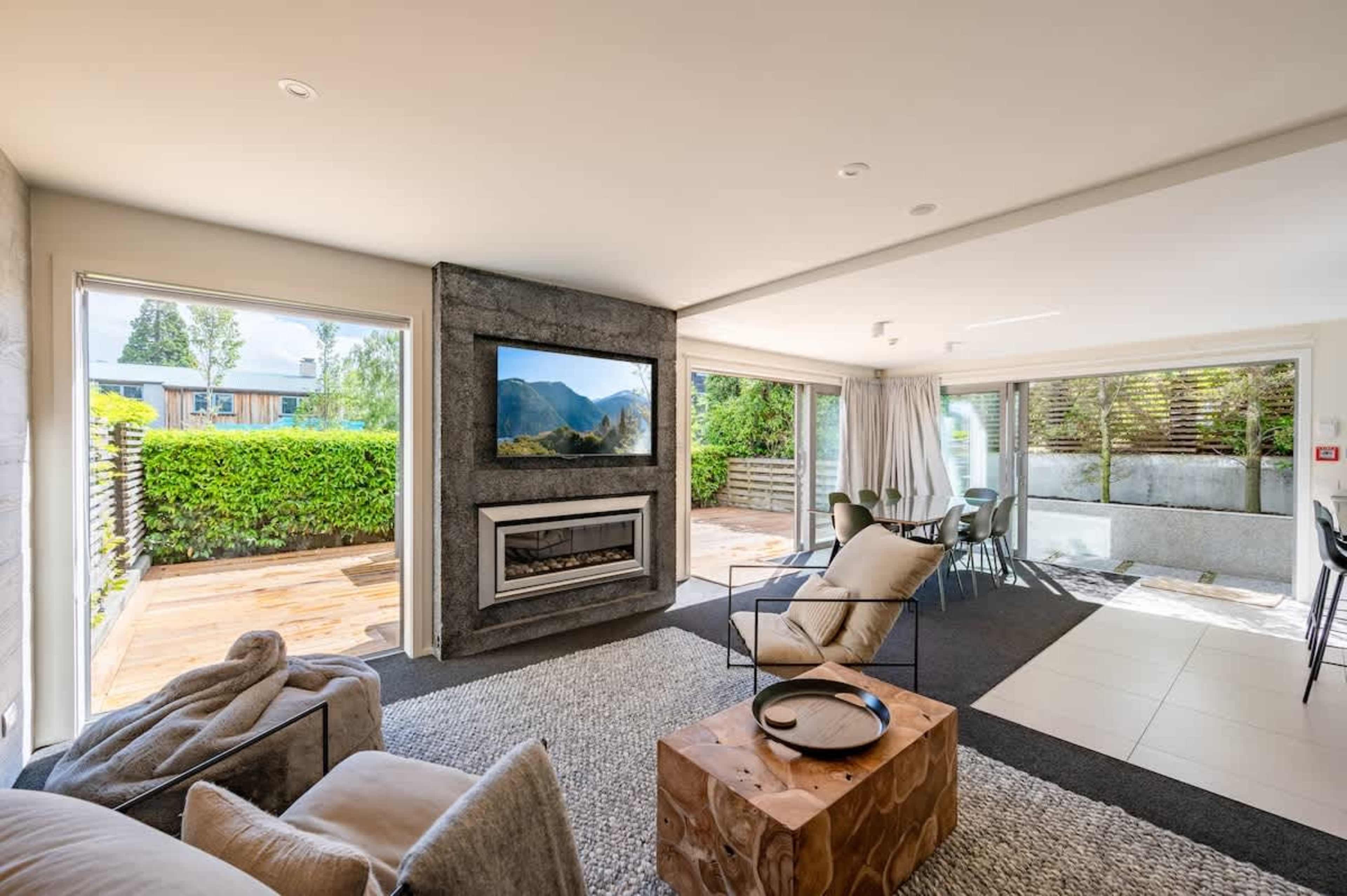 Modern Comfort with Scenic Views This spacious living room blends modern design with cozy comfort, providing the ideal spot to take in the mountain views. A perfect blend of style and serenity.