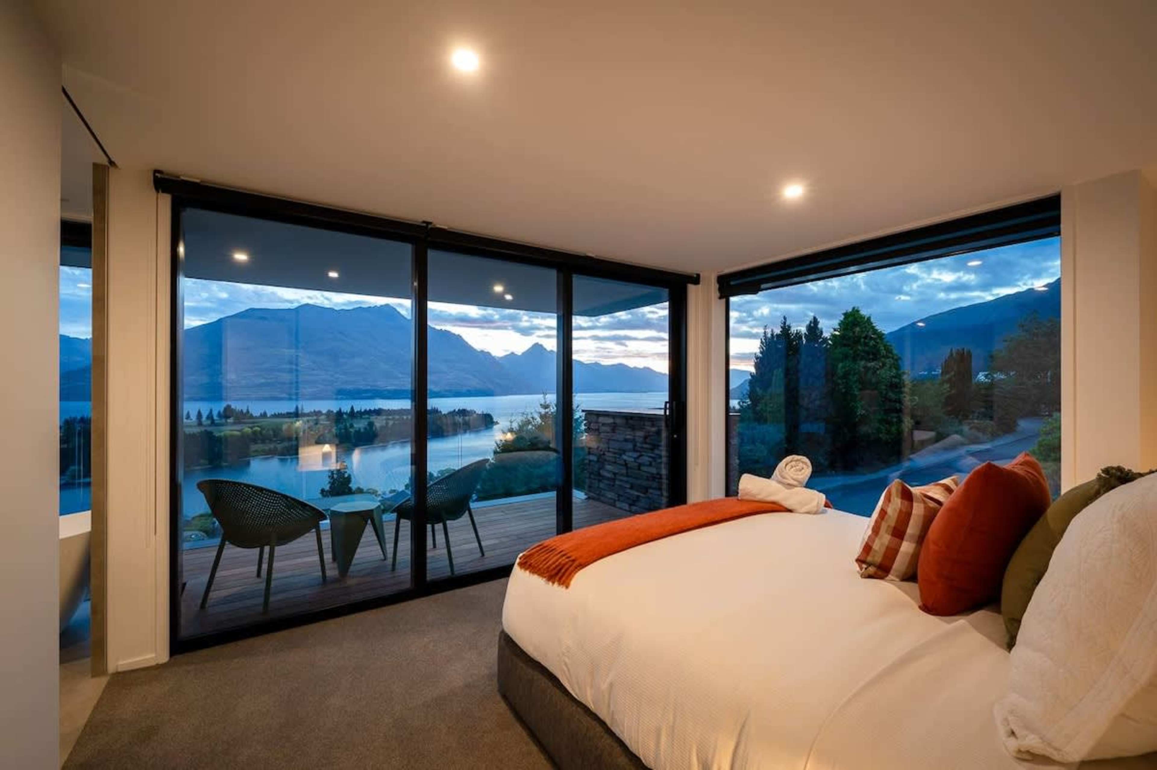 Master Bedroom with Ensuite and Private Patio
The spacious master bedroom features a luxurious ensuite and a private patio, perfect for relaxing while enjoying stunning lake and mountain views.