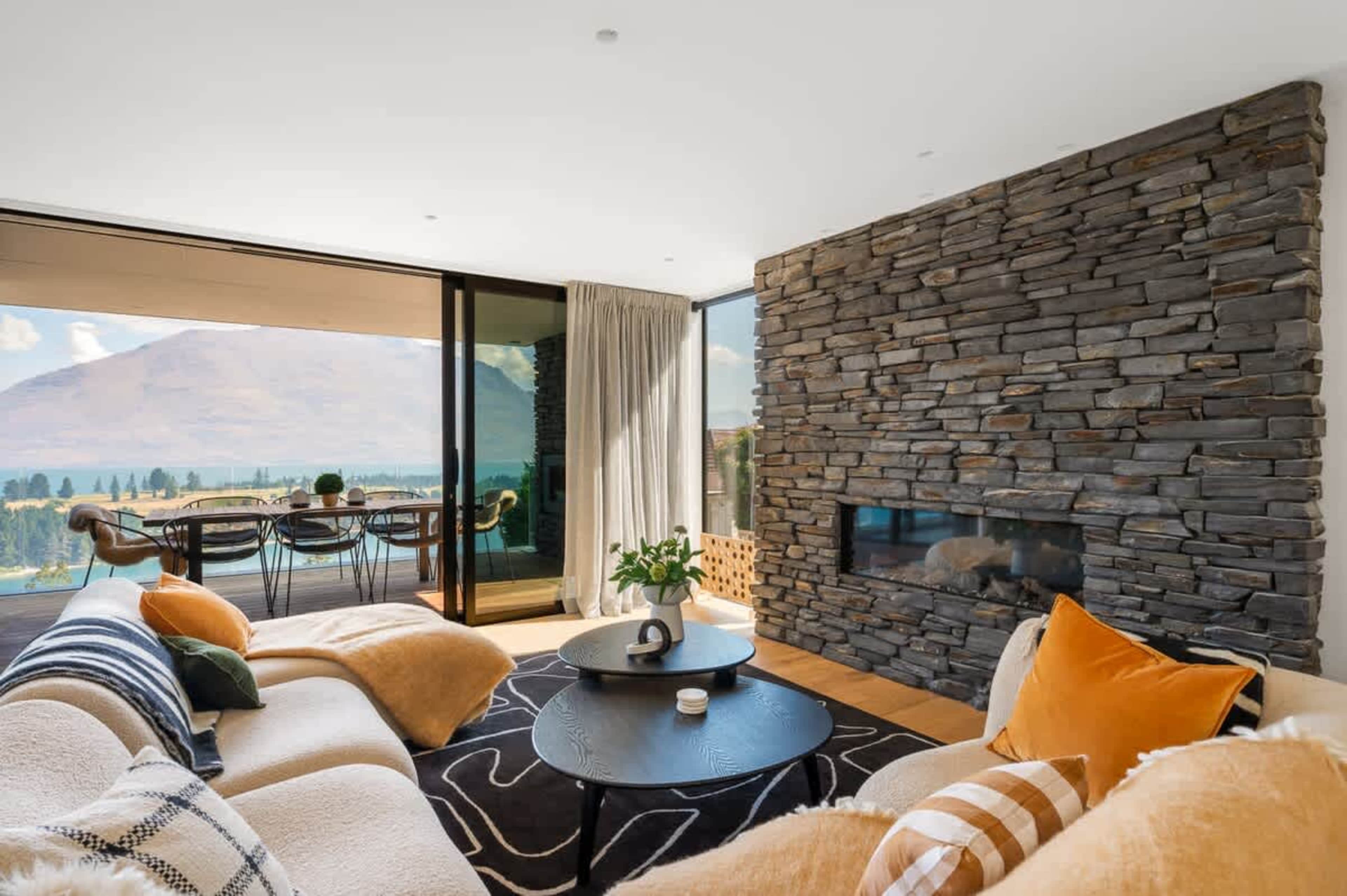Seamless Indoor-Outdoor Flow to Balcony
The living room flows effortlessly to the spacious balcony, where guests can enjoy breathtaking lake and mountain views.