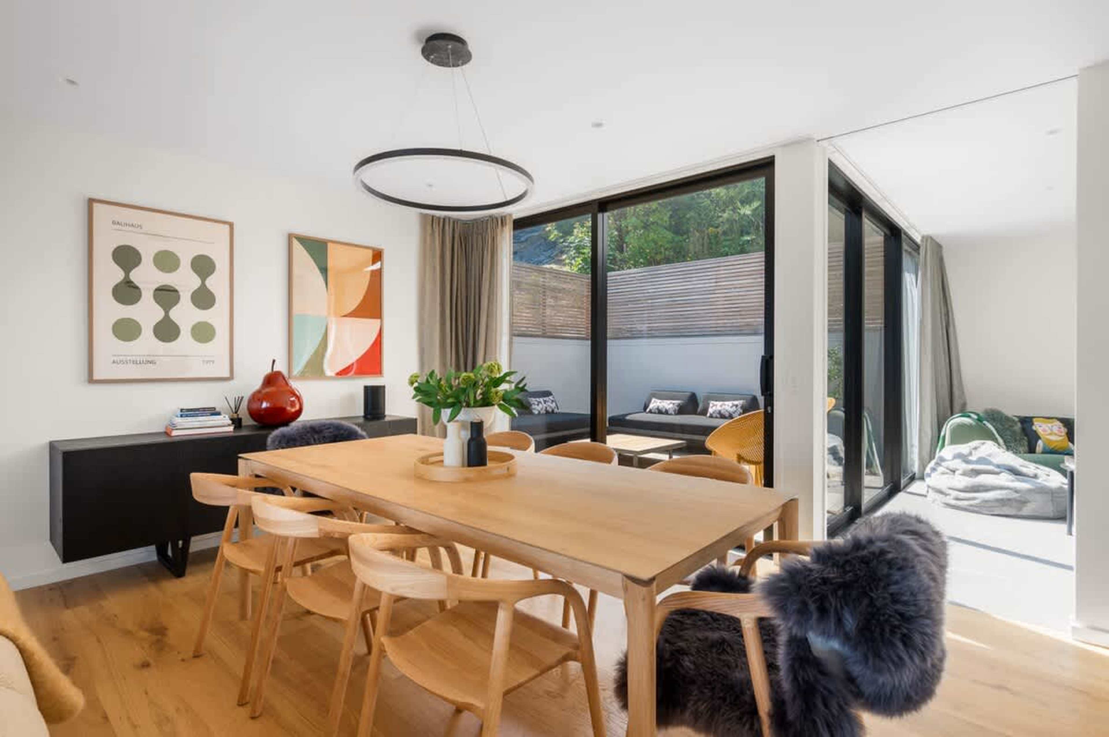 
Indoor Dining Room with Stunning Lake Views
The elegant indoor dining area offers a beautiful setting for meals, with large windows framing the spectacular views of Lake Wakatipu and the surrounding mountains.