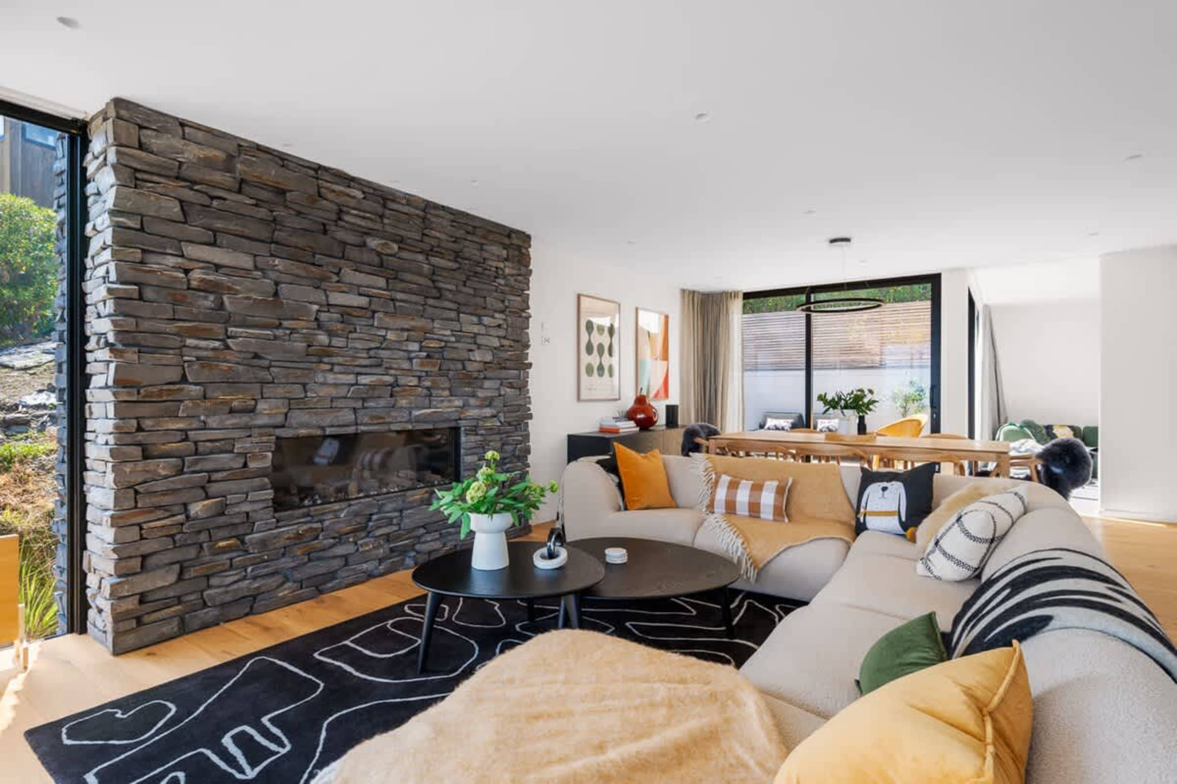 Elegant Living Room with Gas Fireplace & Views
This stylish living room features a cozy gas fireplace, perfect for unwinding while taking in the breathtaking lake and mountain views.