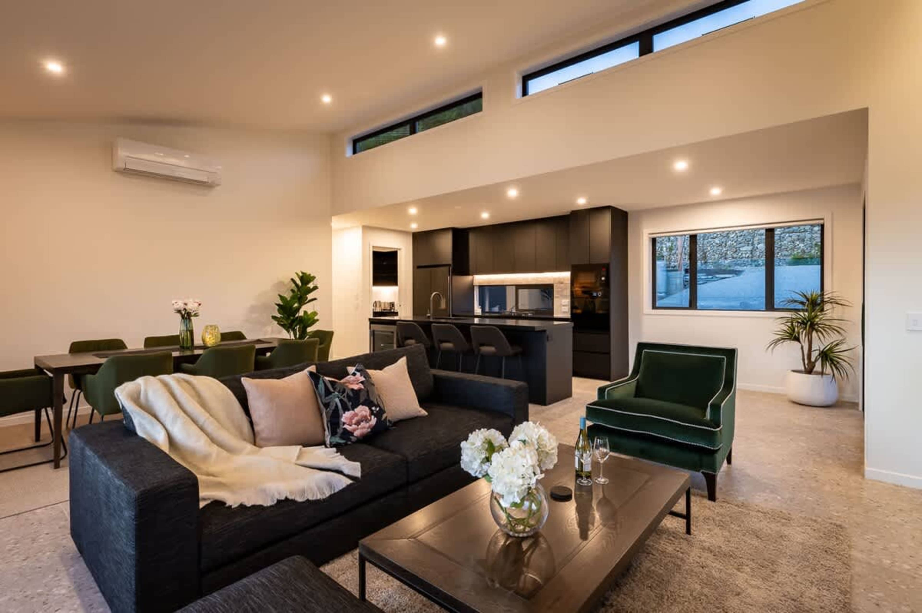 This inviting space offers plenty of room to relax and unwind, with a warm ambiance perfect for those chilly evenings.