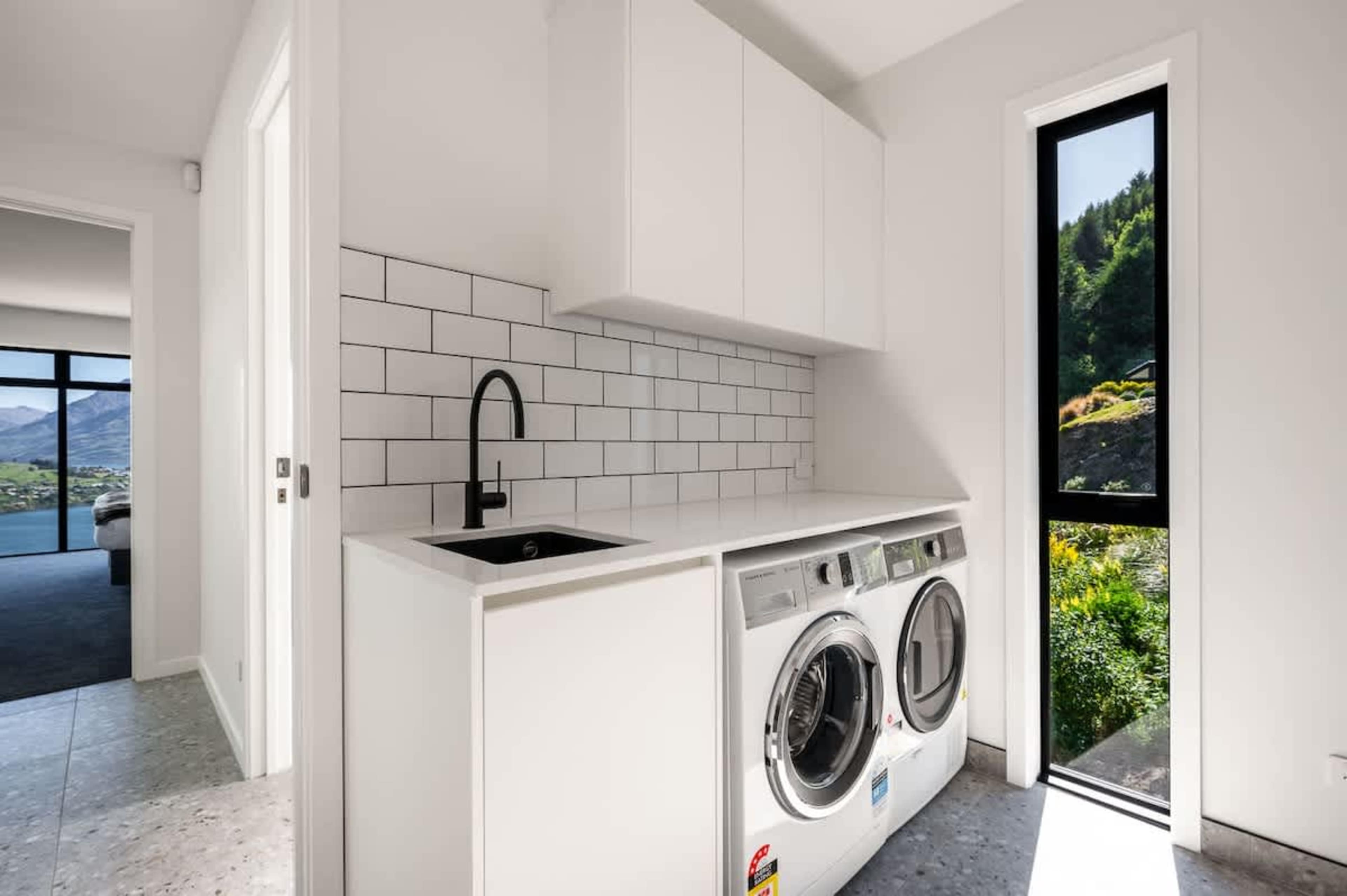 Enjoy the convenience of a well-equipped laundry area, designed for efficiency and practicality, perfect for managing all your cleaning needs after outdoor adventures.