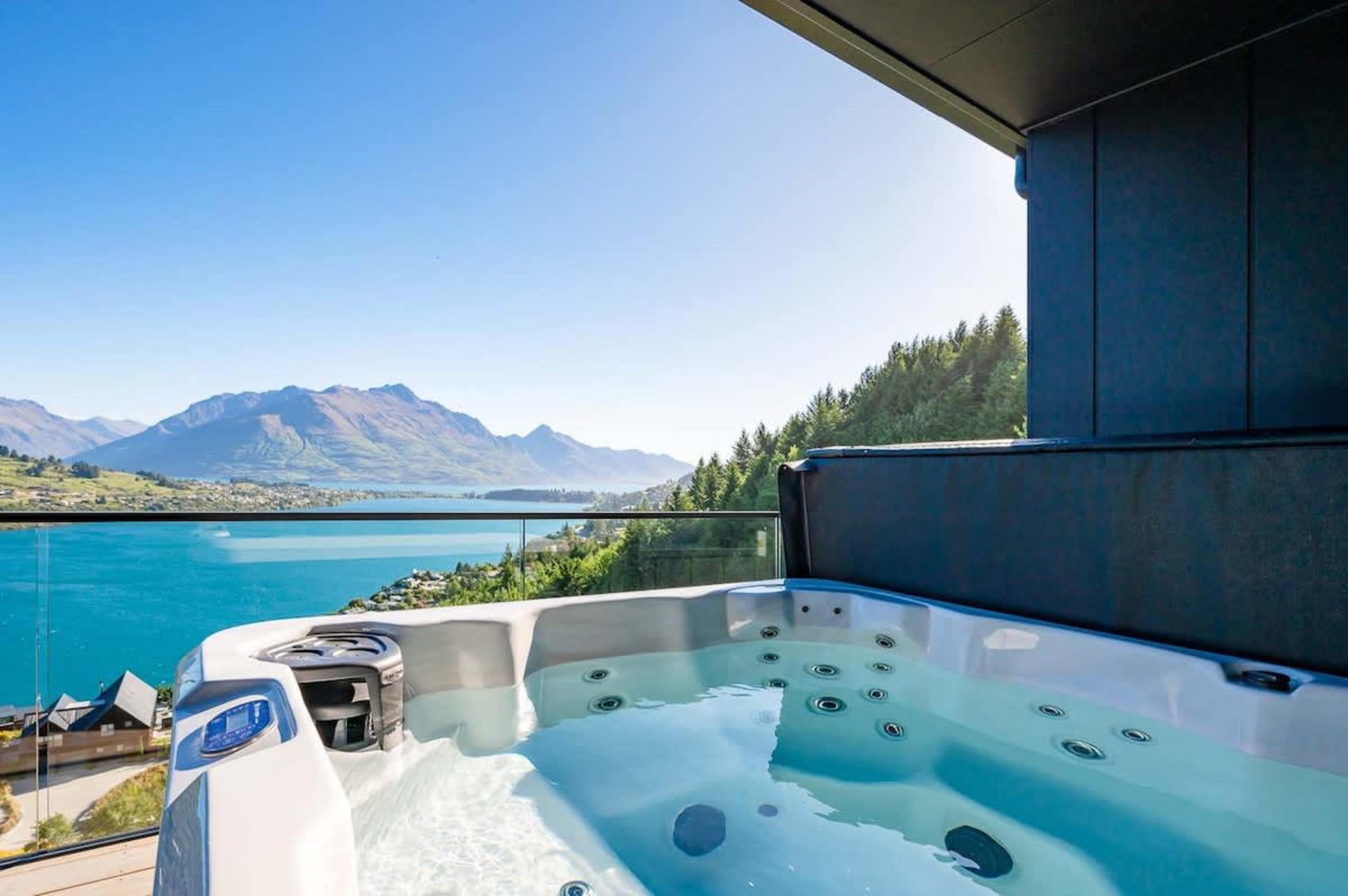 Relax in the Hot Tub with Scenic Views – Unwind in the private hot tub on the balcony, soaking in the beautiful mountain views while you relax with a glass of wine in hand.