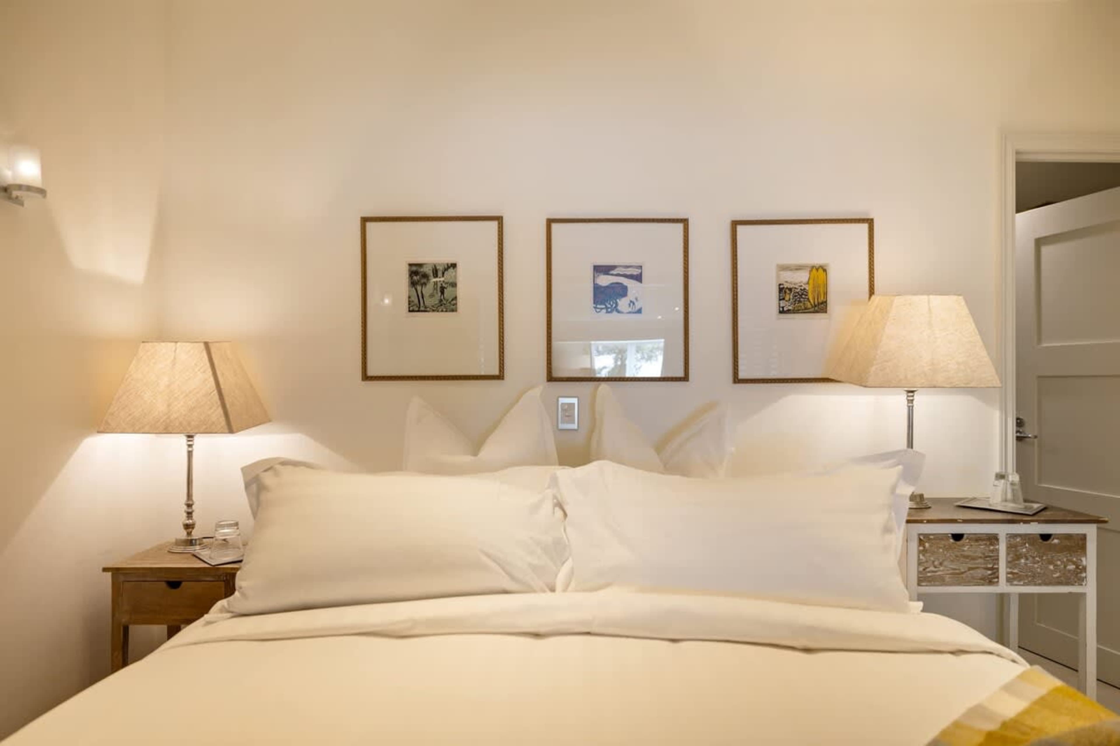 Luxury & Serenity in Every Detail – Sink into the soft, hotel-quality bedding in this quiet and stylish master bedroom, complete with blackout blinds and air-conditioning.
