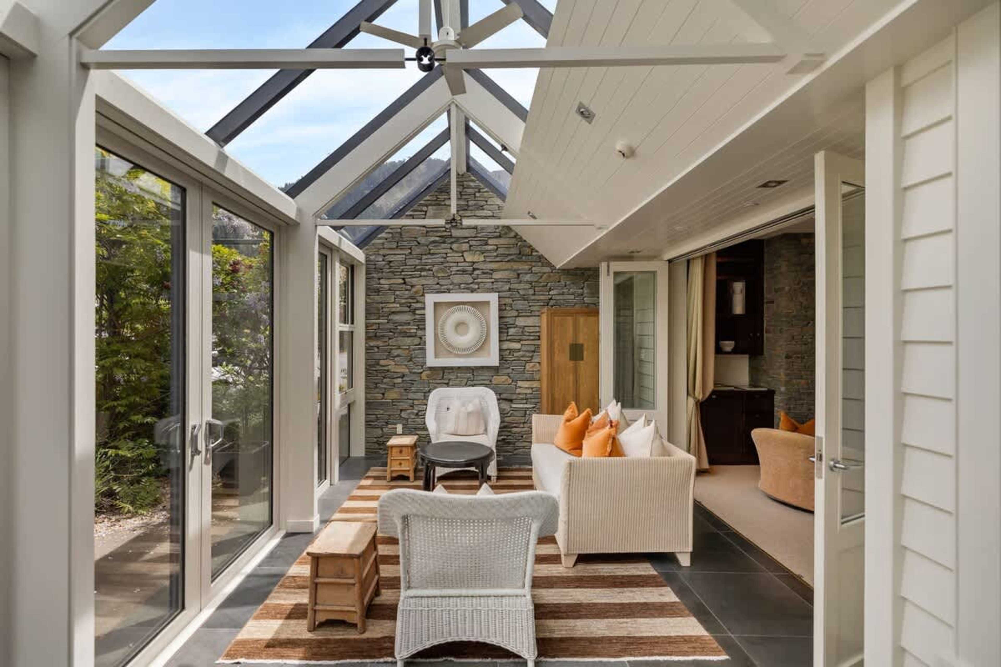 Sun-Drenched with Stunning Vistas – Enjoy your morning coffee or an evening glass of wine while taking in panoramic lake and mountain views from this bright conservatory.