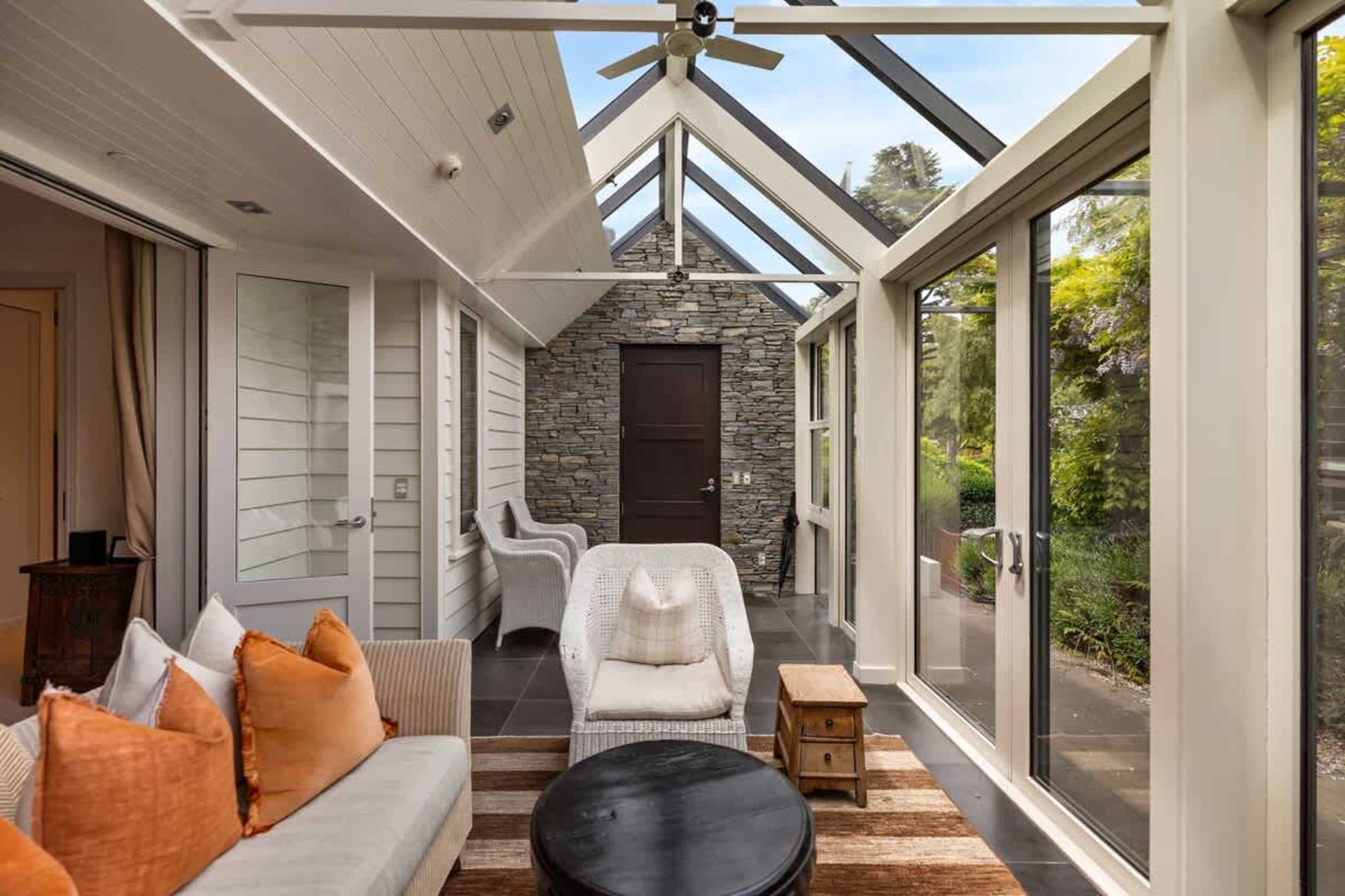 Unwind with Queenstown’s Best Views – The conservatory offers a serene space to relax, with floor-to-ceiling windows showcasing the breathtaking lakefront scenery.