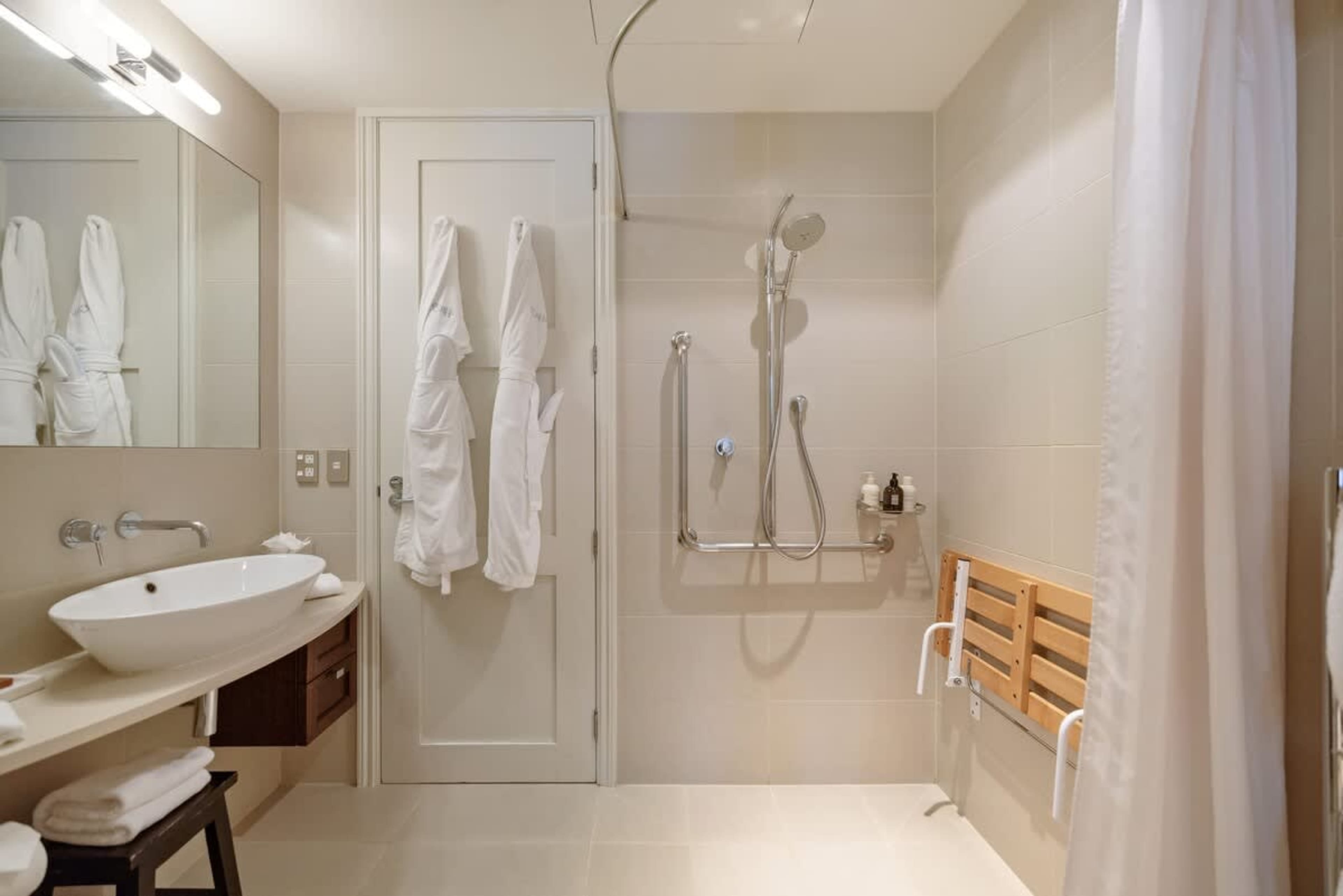 Private Ensuite with Premium Touches – Featuring high-end toiletries, bathrobes, slippers, and luxury towels, this elegant ensuite provides a true hotel-style experience.