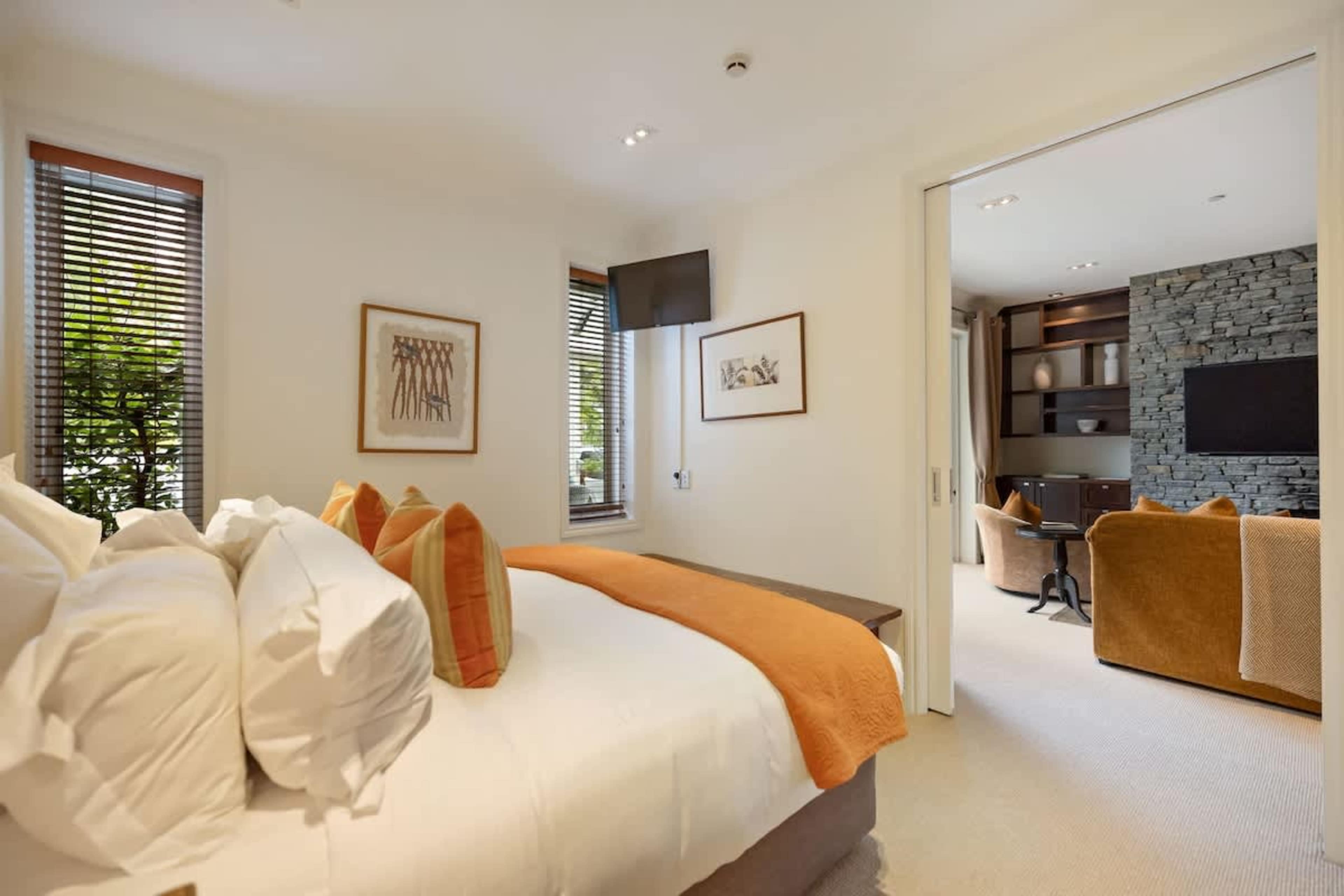 Cozy & Elegant Second Bedroom – A beautifully styled second bedroom featuring a plush king bed, luxury linen, and full climate control for year-round comfort.