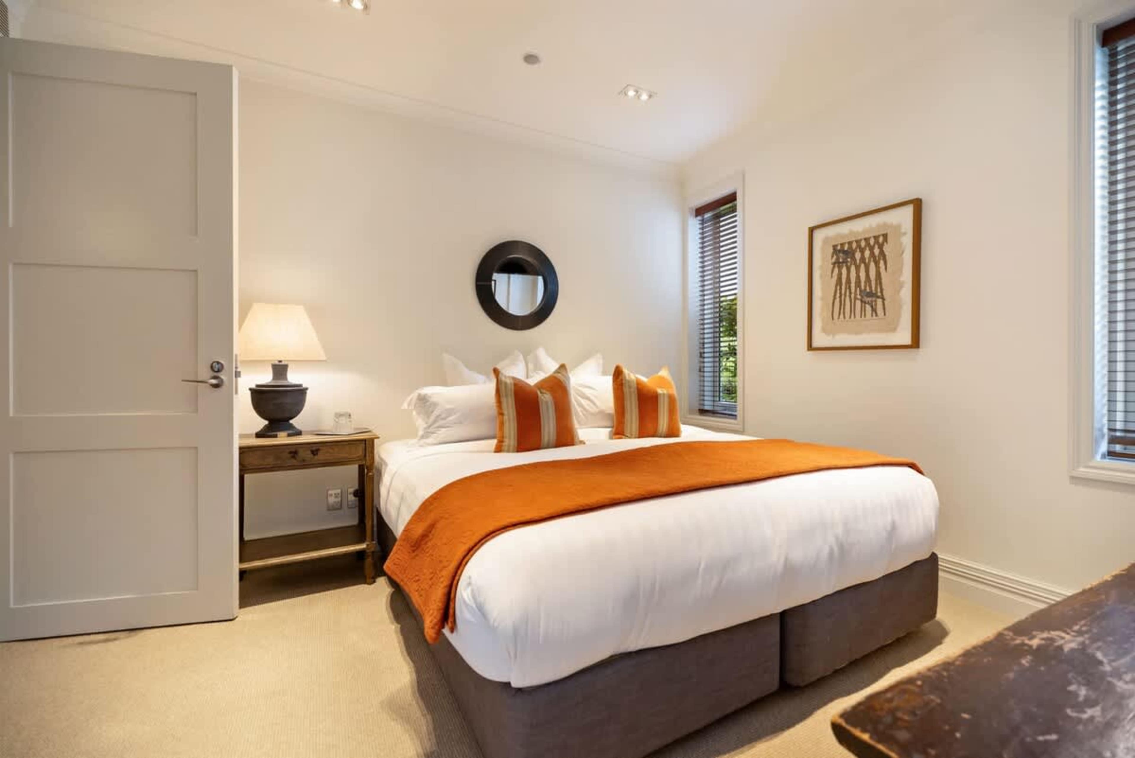 Spacious & Private Retreat – With a king bed, luxe bedding, and full air-conditioning, this bedroom is a perfect blend of style and comfort.