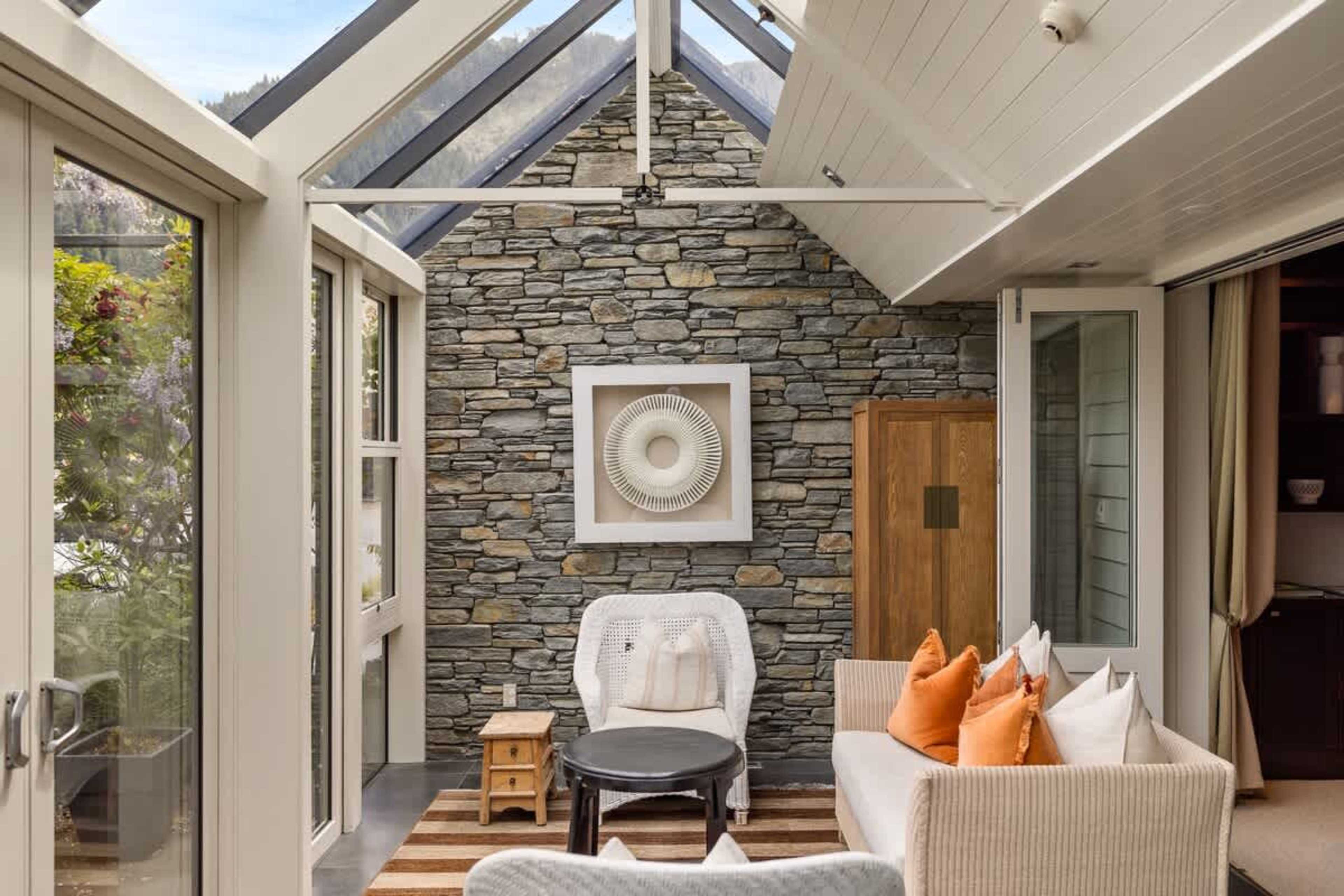 Sun-Drenched with Stunning Vistas – Enjoy your morning coffee or an evening glass of wine while taking in panoramic lake and mountain views from this bright conservatory.