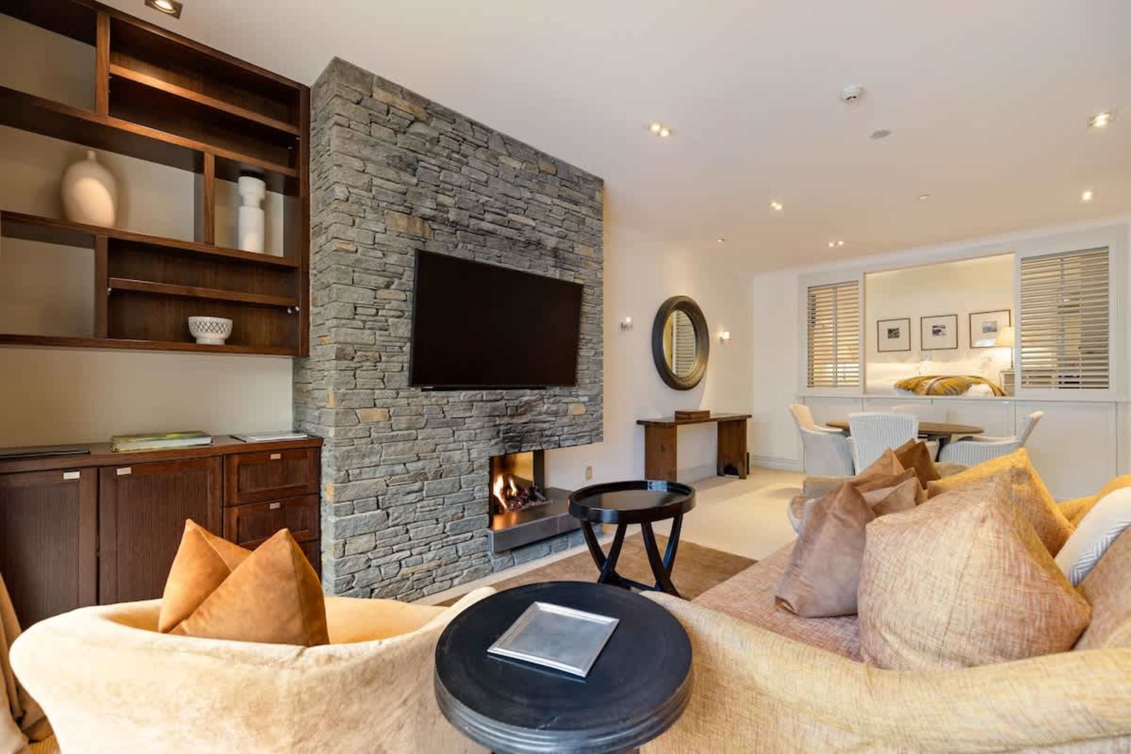 Spacious, Stylish & Sunlit – The open-plan living room flows seamlessly into a beautiful conservatory, creating a bright and inviting space with both warmth and comfort.