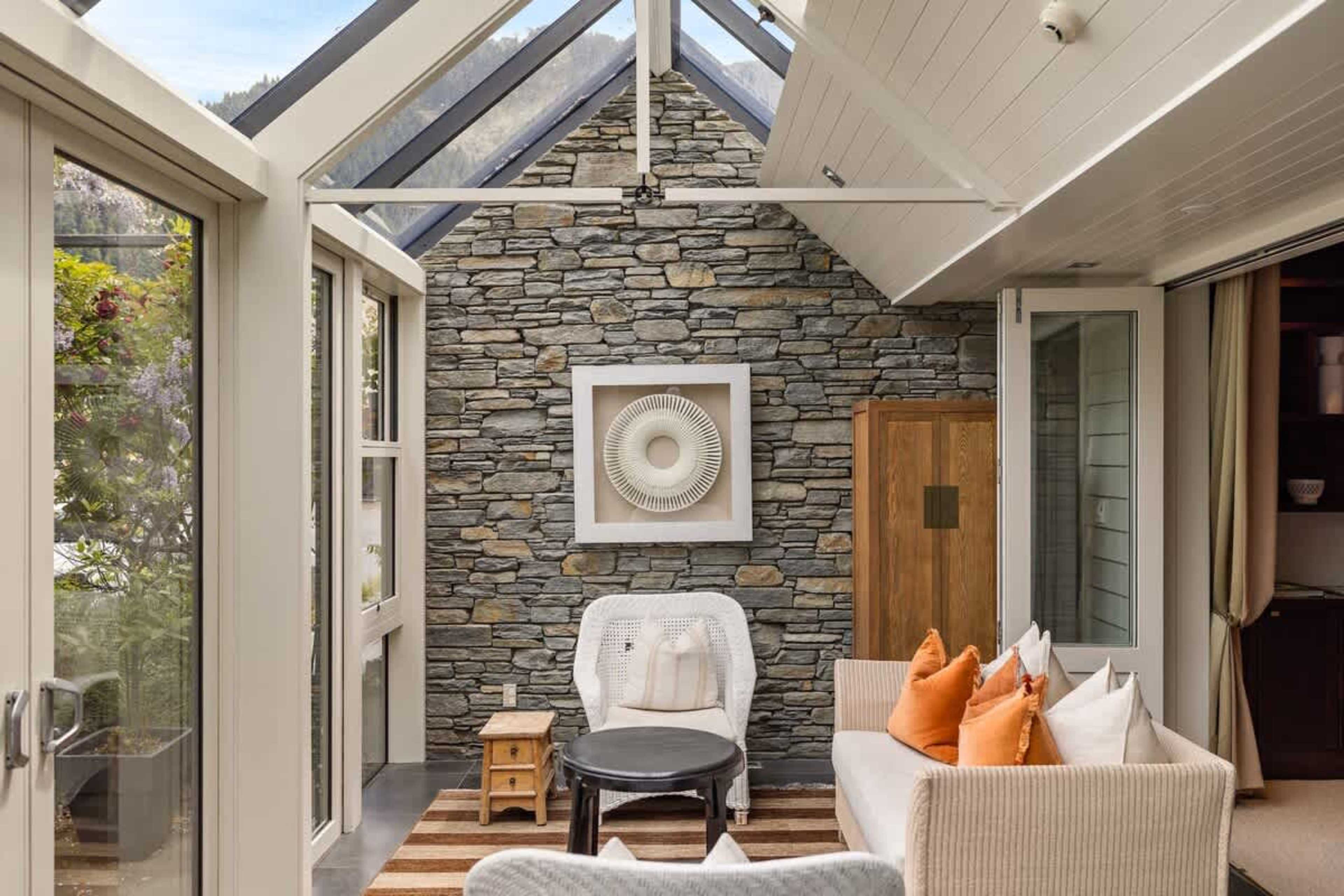 Sun-Drenched with Stunning Vistas – Enjoy your morning coffee or an evening glass of wine while taking in panoramic lake and mountain views from this bright conservatory.