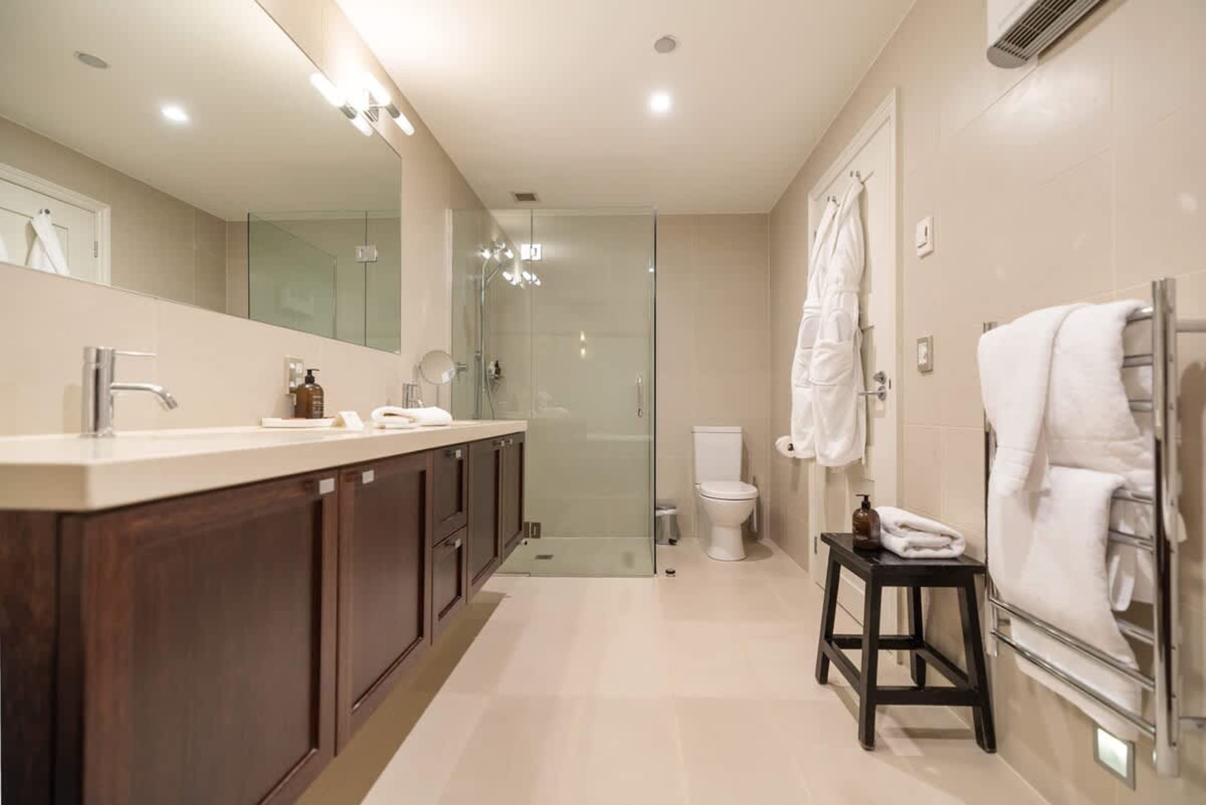 Pamper Yourself in Luxury – Relax in this beautifully designed ensuite with premium amenities, robes, and slippers, perfect for unwinding after a day of adventure.