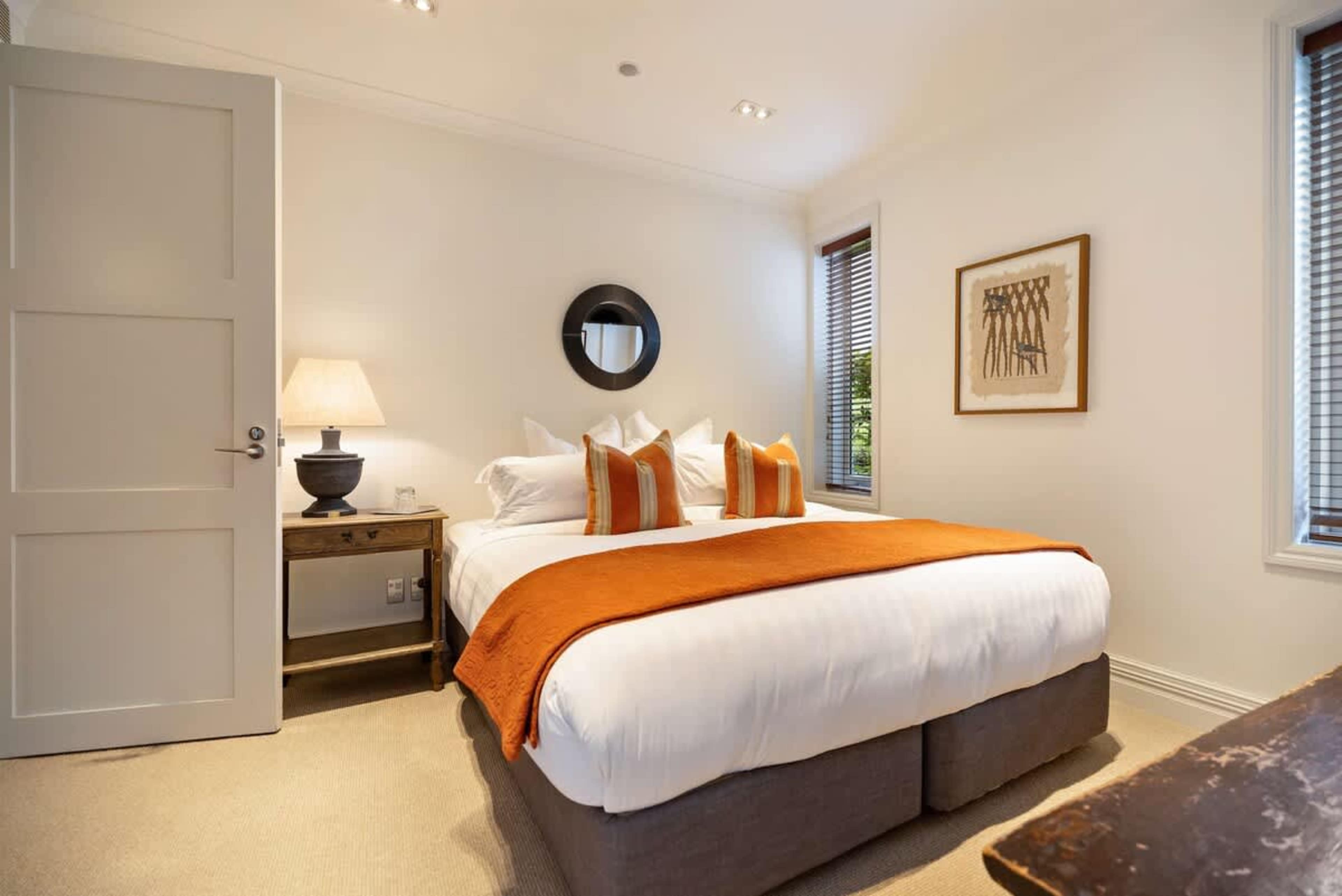 Spacious & Private Retreat – With a king bed, luxe bedding, and full air-conditioning, this bedroom is a perfect blend of style and comfort.