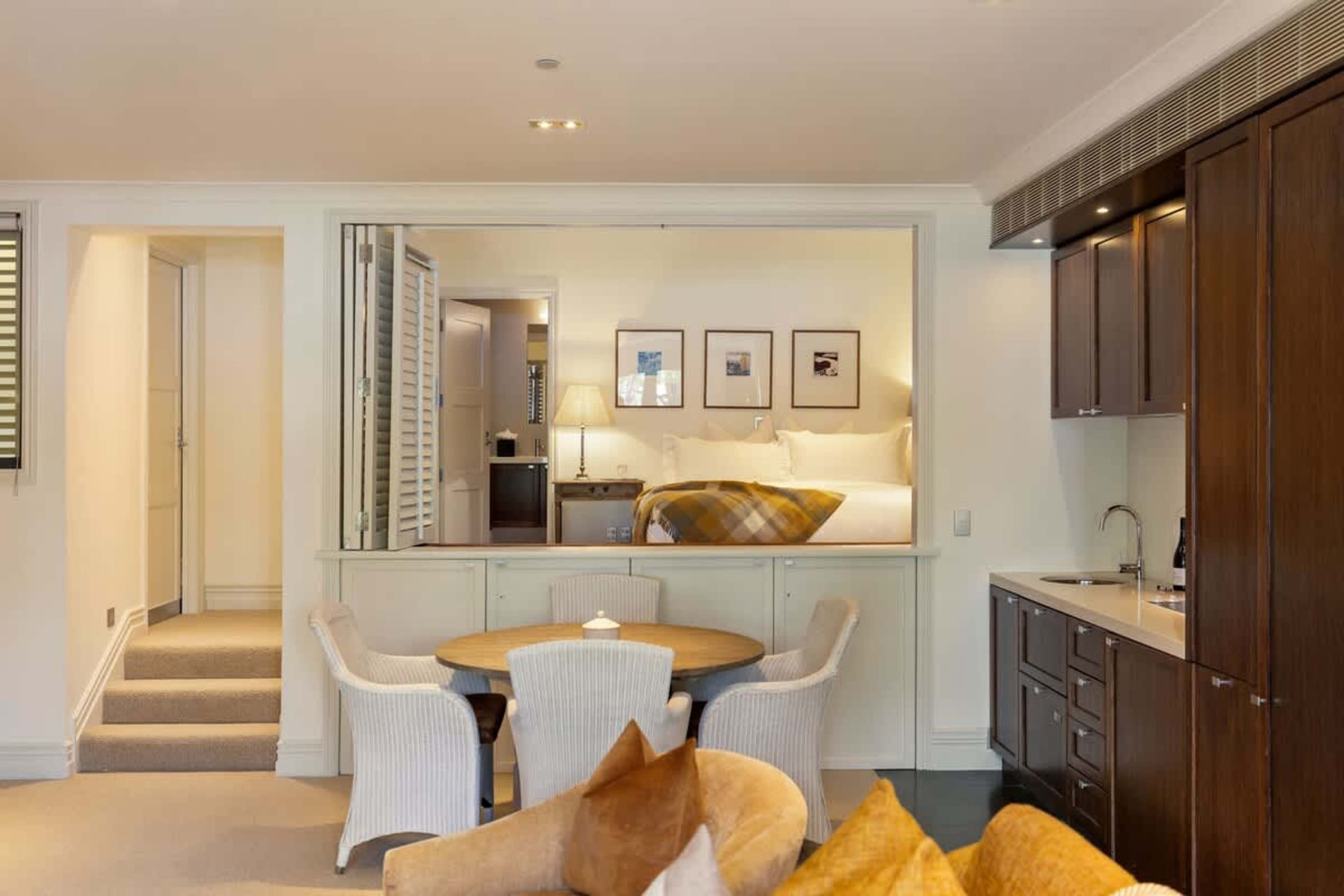 Charming Dining Area – The intimate dining space provides a warm and inviting spot to enjoy meals, with an open layout that makes it perfect for spending time with loved ones or savoring a solo meal.