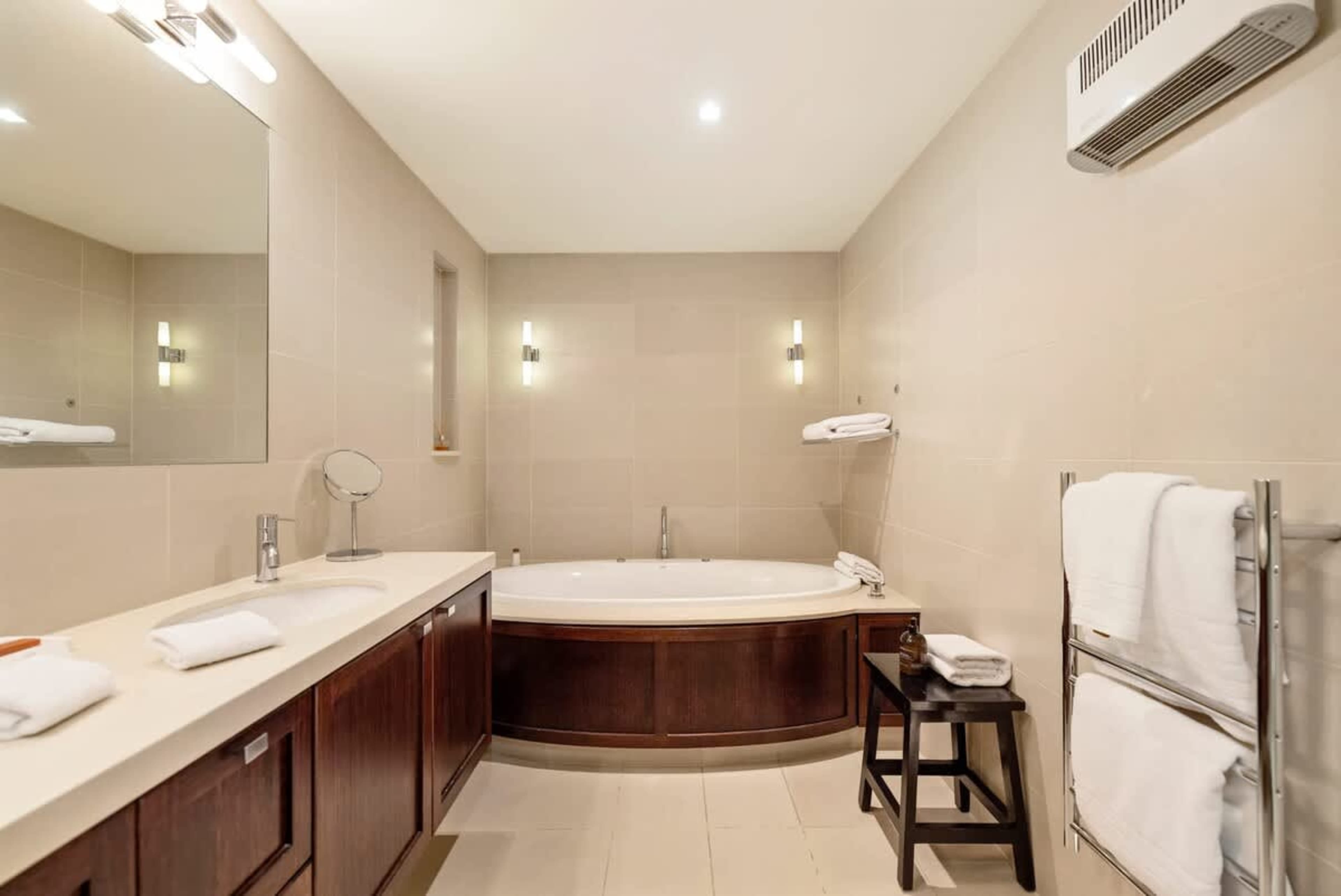 Indulge in Relaxation – The stylish ensuite bathroom offers a rain shower, premium bathrobes, slippers, and luxury toiletries, ensuring you feel pampered and refreshed throughout your stay.