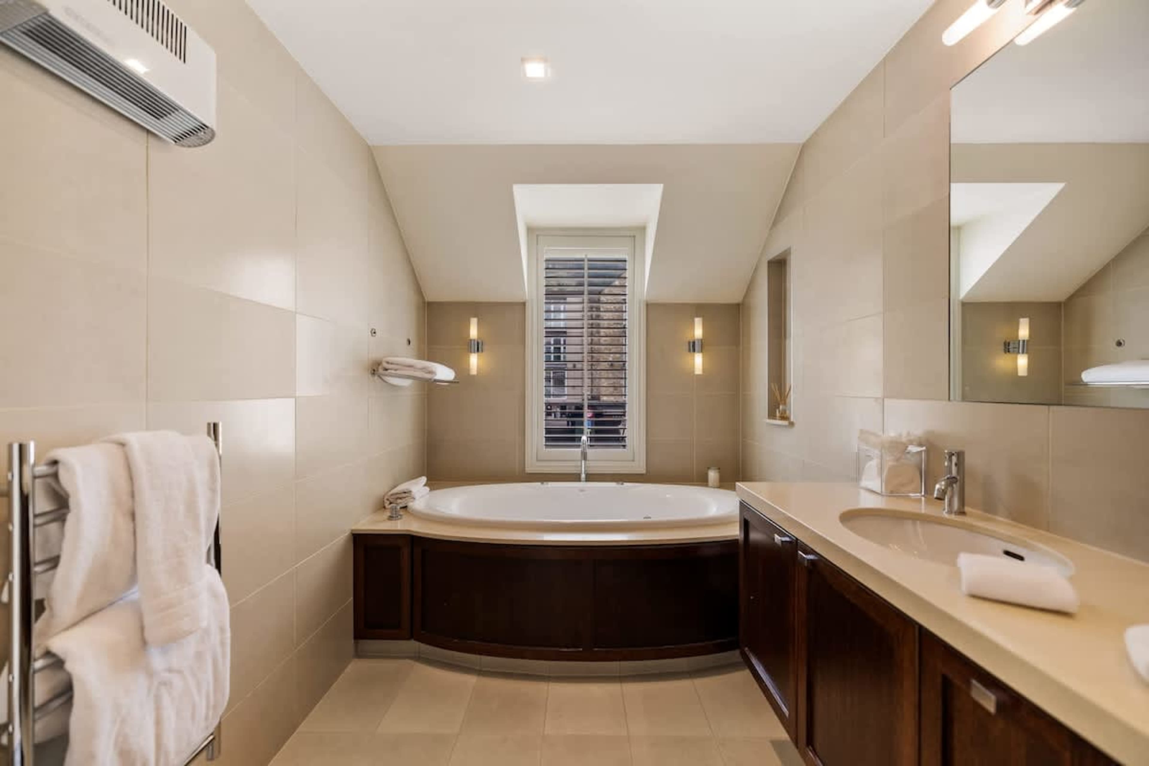 Spa-Like Luxury & Comfort – Indulge in a premium bathroom experience with hotel-grade towels, plush bathrobes, and slippers, all complemented by high-end amenities for a five-star stay.