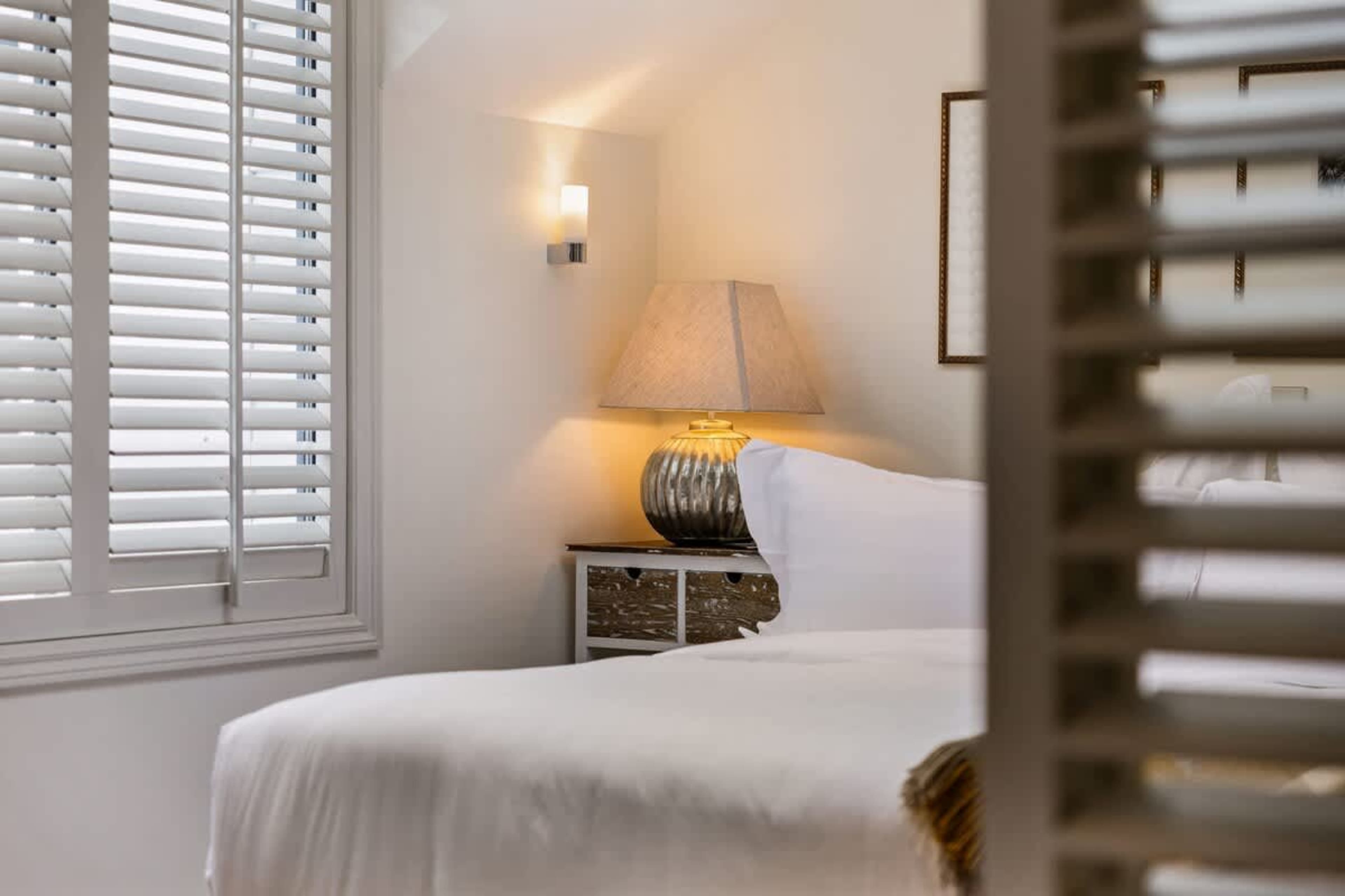 Five-Star Master Suite – Experience a quiet, restful retreat in this spacious master bedroom, with a new luxe bed, blackout blinds, and air-conditioning, ensuring comfort and peace.