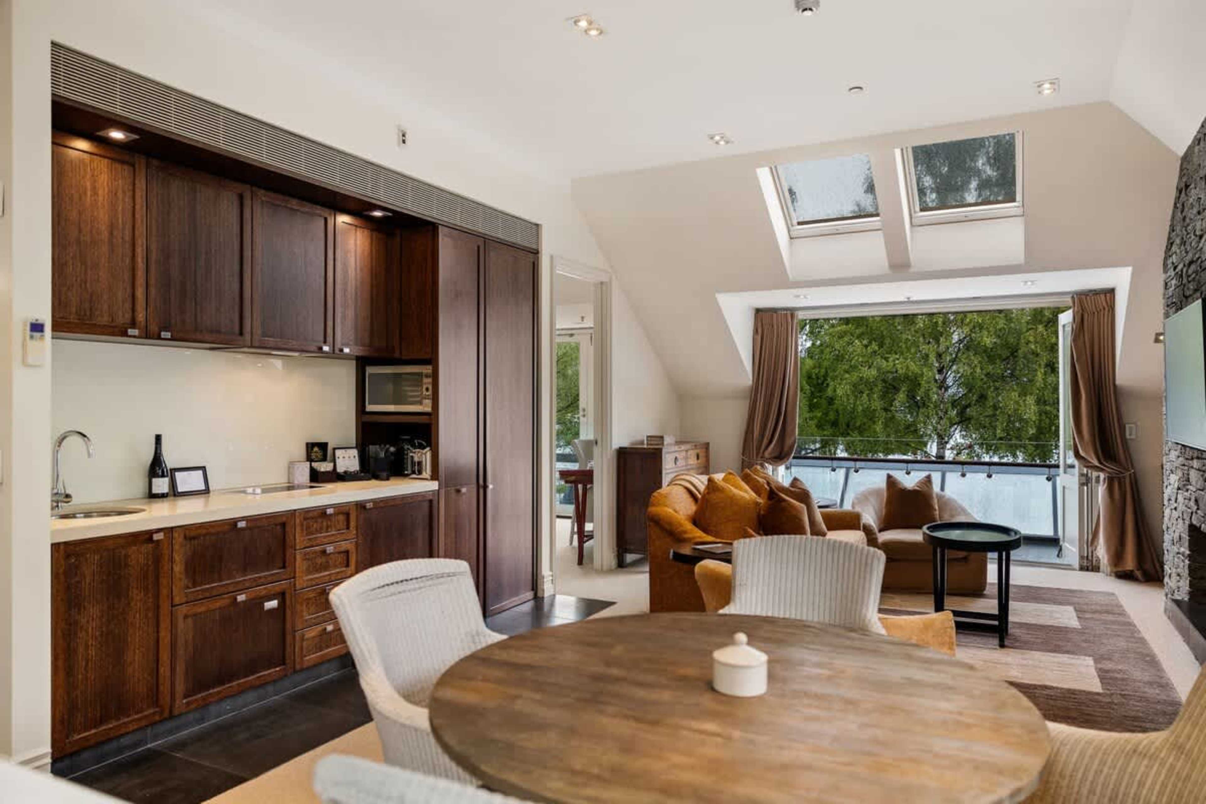 Gather & Enjoy – Whether it's a morning coffee or a gourmet dinner, the stylish dining area offers a cozy and inviting space to share meals with loved ones.