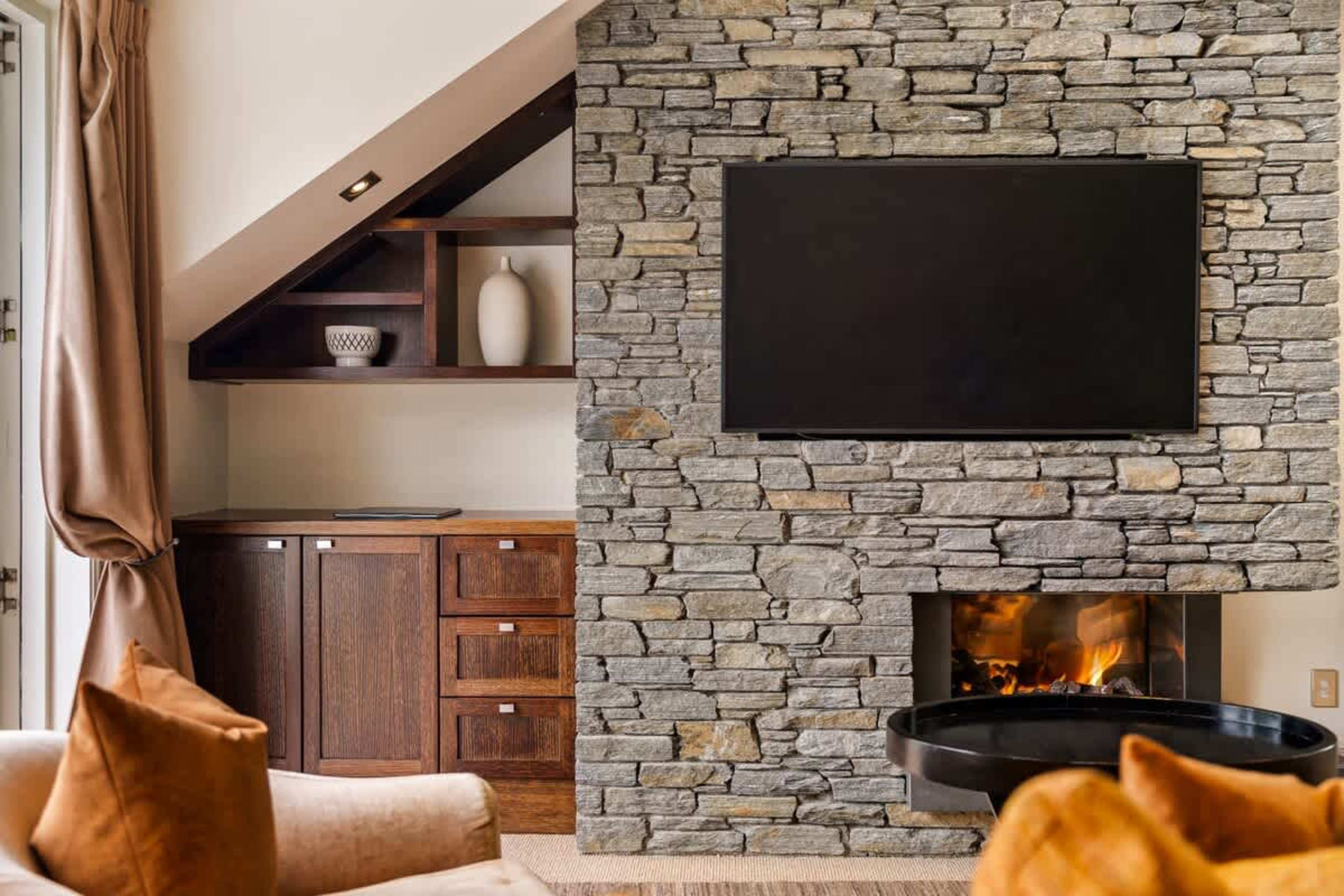 Entertainment & Relaxation in One – This spacious living room offers a large TV, high-speed Wi-Fi, and cozy seating, creating the perfect space to enjoy a quiet night in.