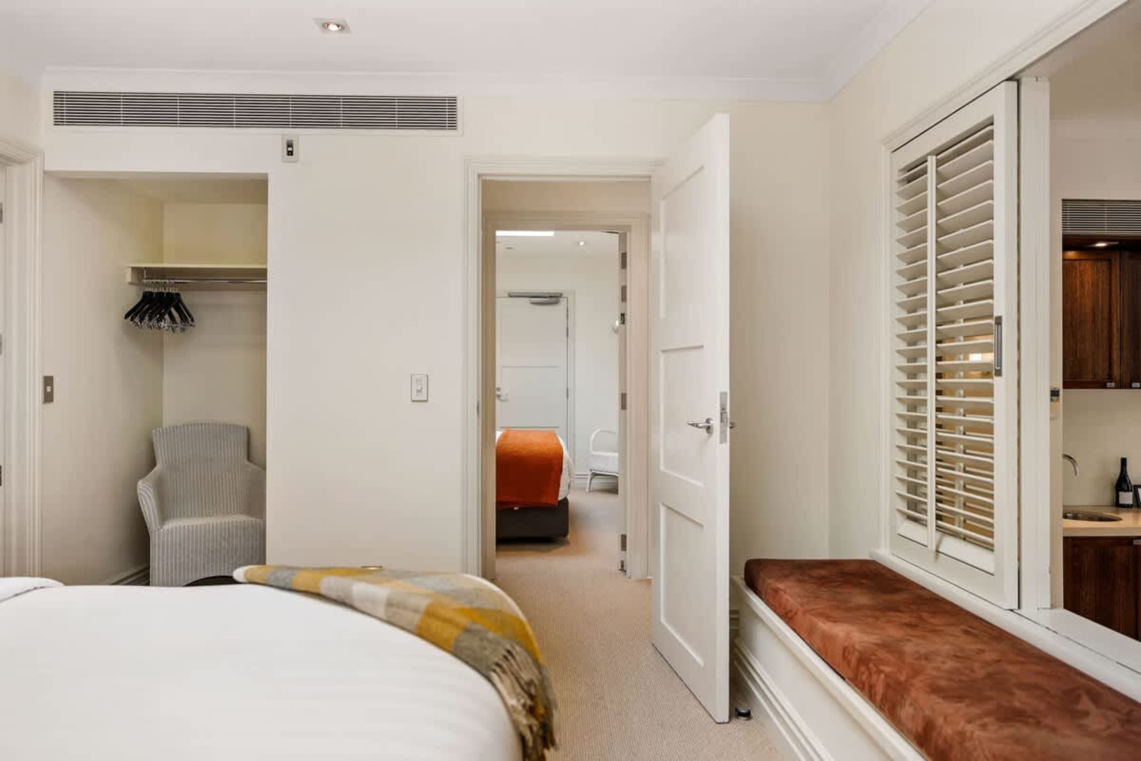 Your Private Sanctuary – This master bedroom offers elegance and tranquility with high-end linens, blackout blinds, and an ensuite, ensuring a luxurious and relaxing stay.