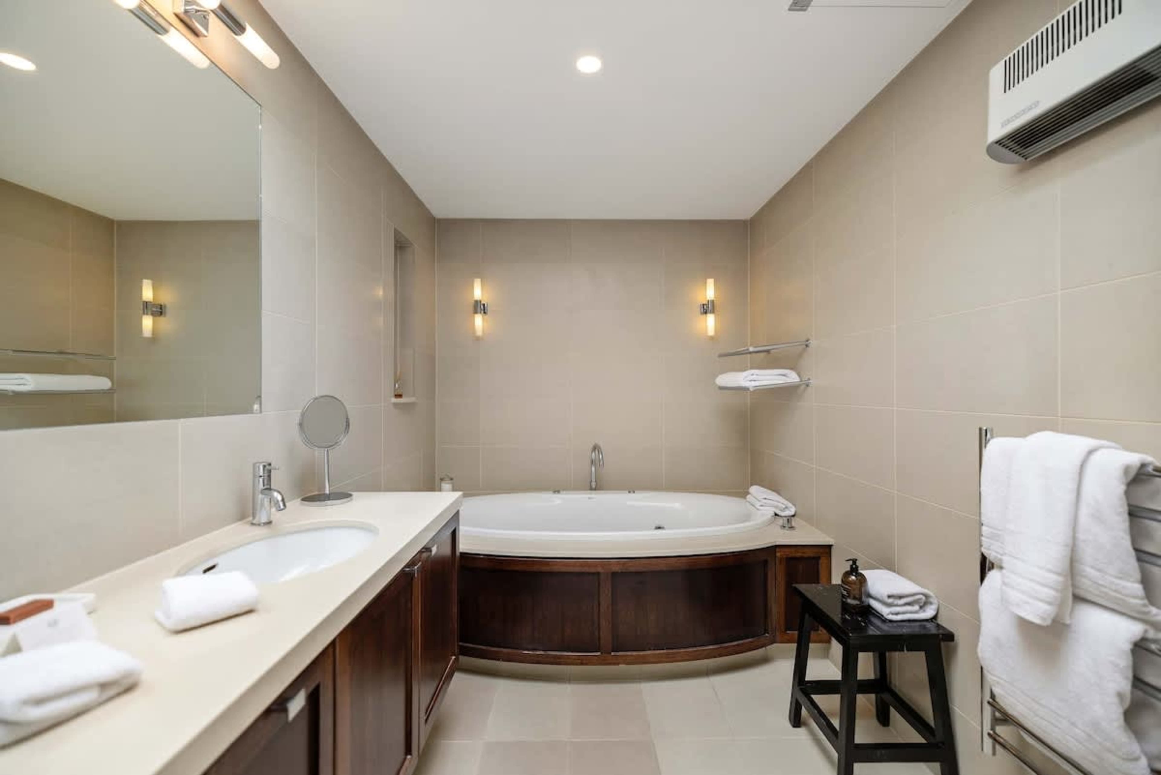 Spa-Like Ensuite with Premium Touches – Indulge in luxury bathrobes, slippers, and hotel-grade towels, paired with high-end toiletries for a five-star experience.
