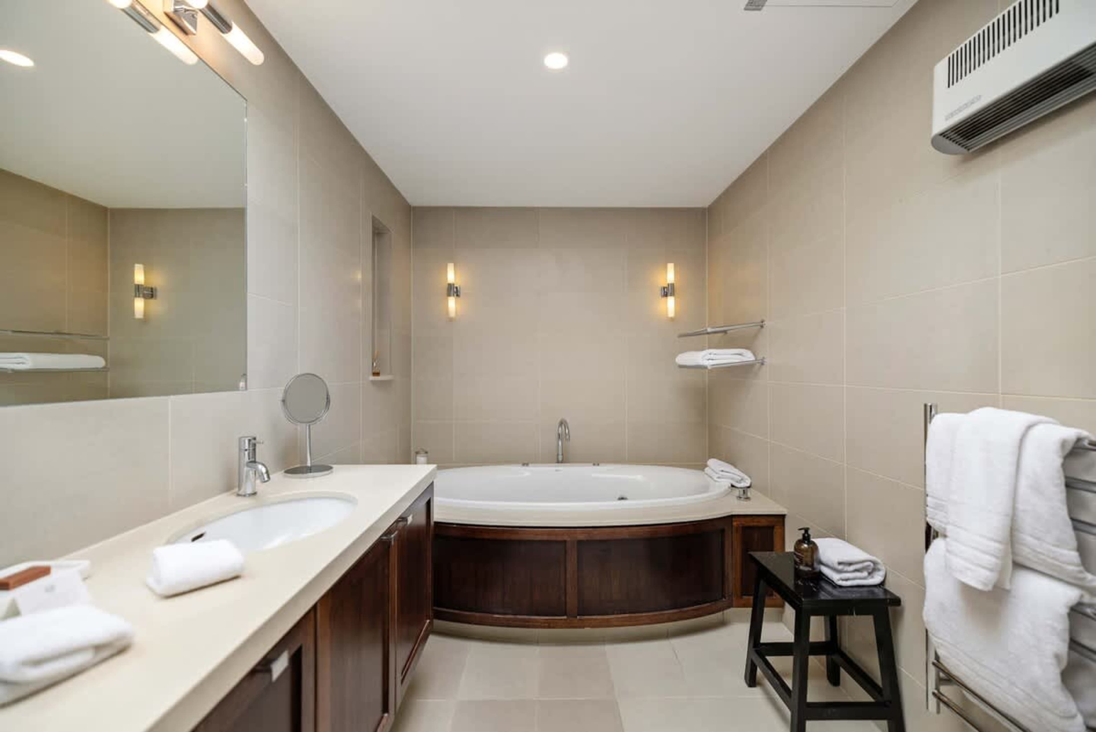 Spa-Like Ensuite with Premium Touches – Indulge in luxury bathrobes, slippers, and hotel-grade towels, paired with high-end toiletries for a five-star experience.