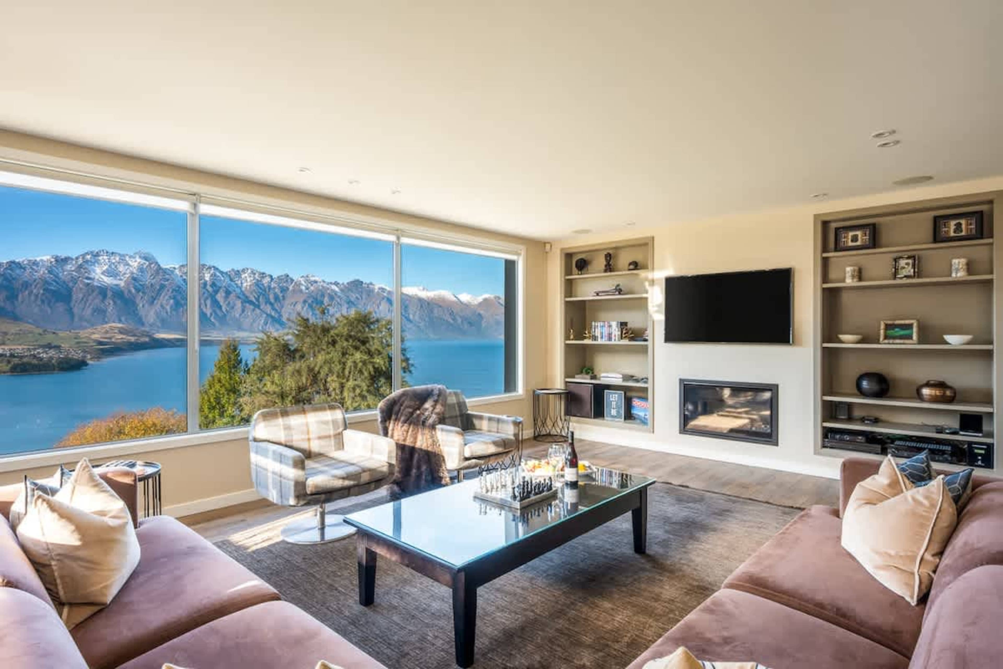 Stylish furnishings and natural light create a welcoming atmosphere in the living area. It’s an ideal spot to enjoy quality time or simply take in the breathtaking scenery.